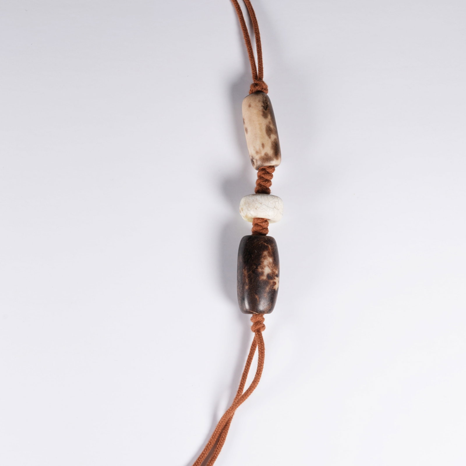 A SET OF ARCHAIC JADE LEZI PENDANTS: Set of Archaic Jade Lezi Pendants