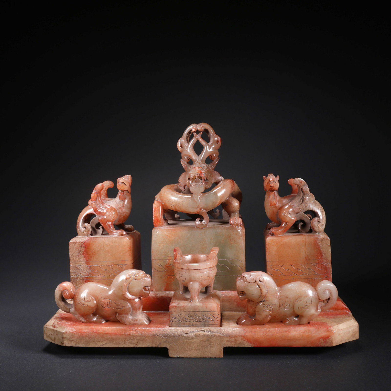 A HETIAN JADE SET OF SEVEN COMBINED SEALS: Hetian Jade Set of Seven Combined Seals