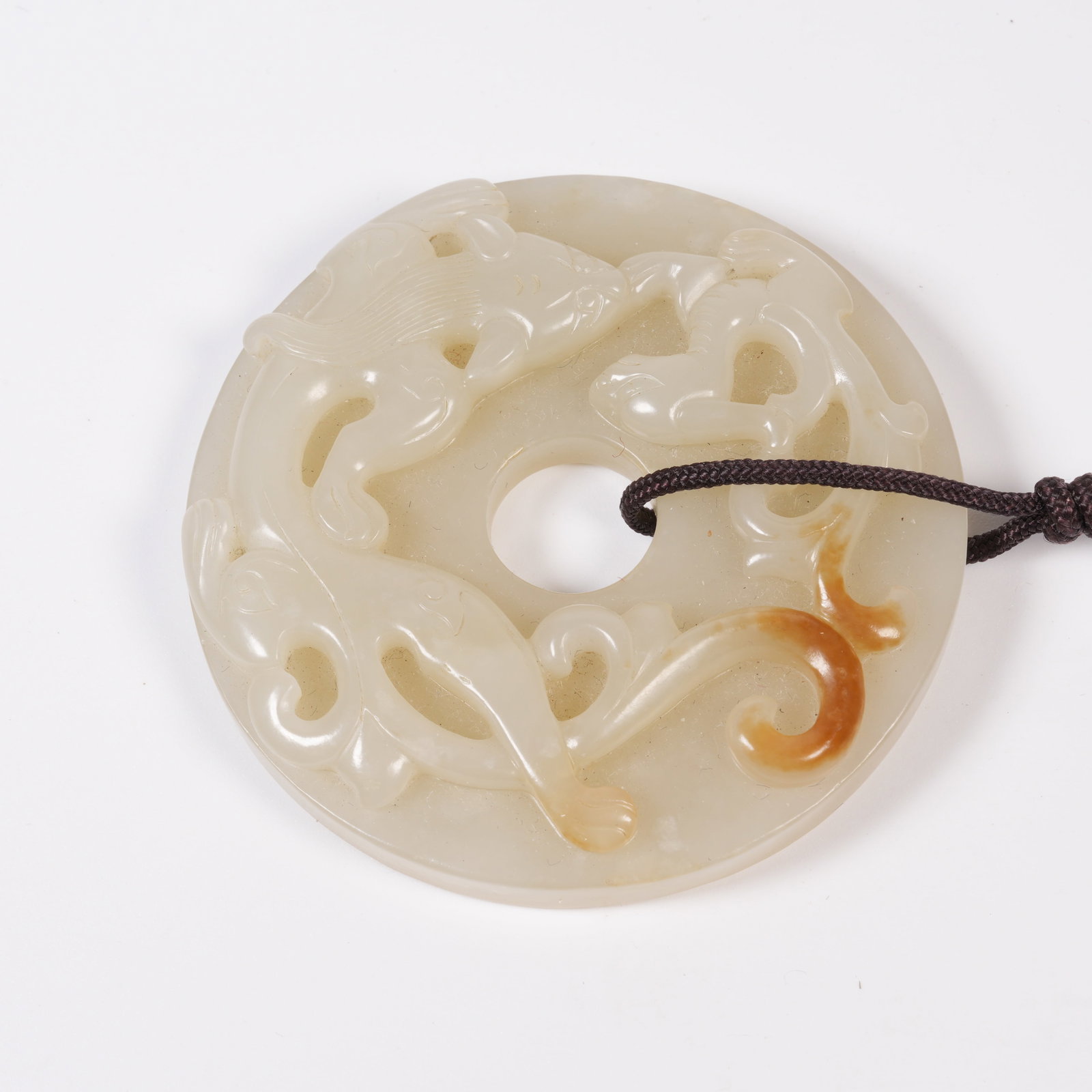 A HETIAN JADE BI DISC WITH CHI DRAGON MOTIF (1 of 10)