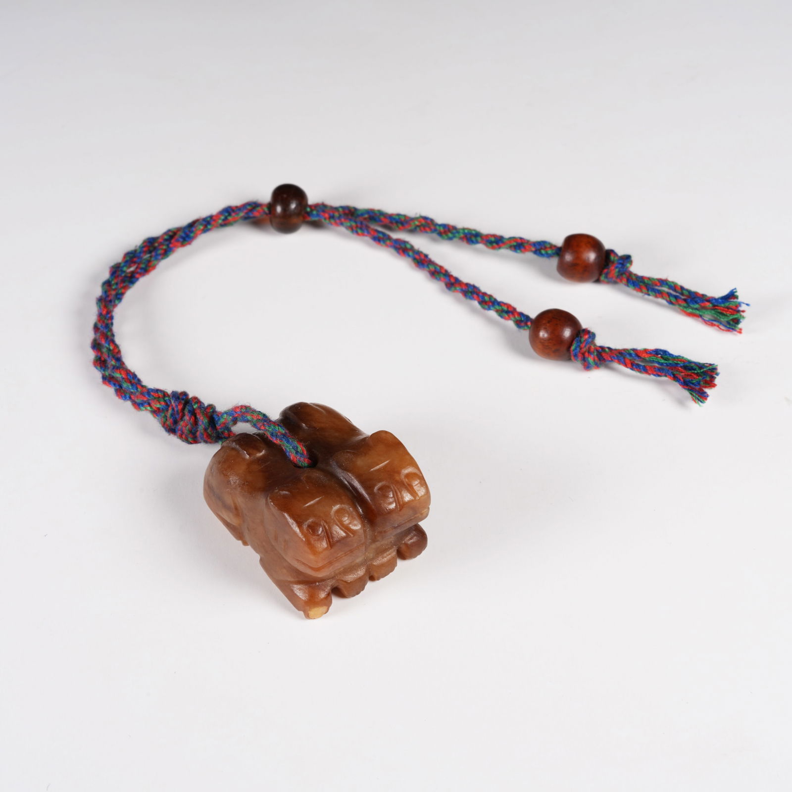 A ARCHAIC JADE DOUBLE-TIGER PENDANT: Archaic Jade Double-Tiger Pendant