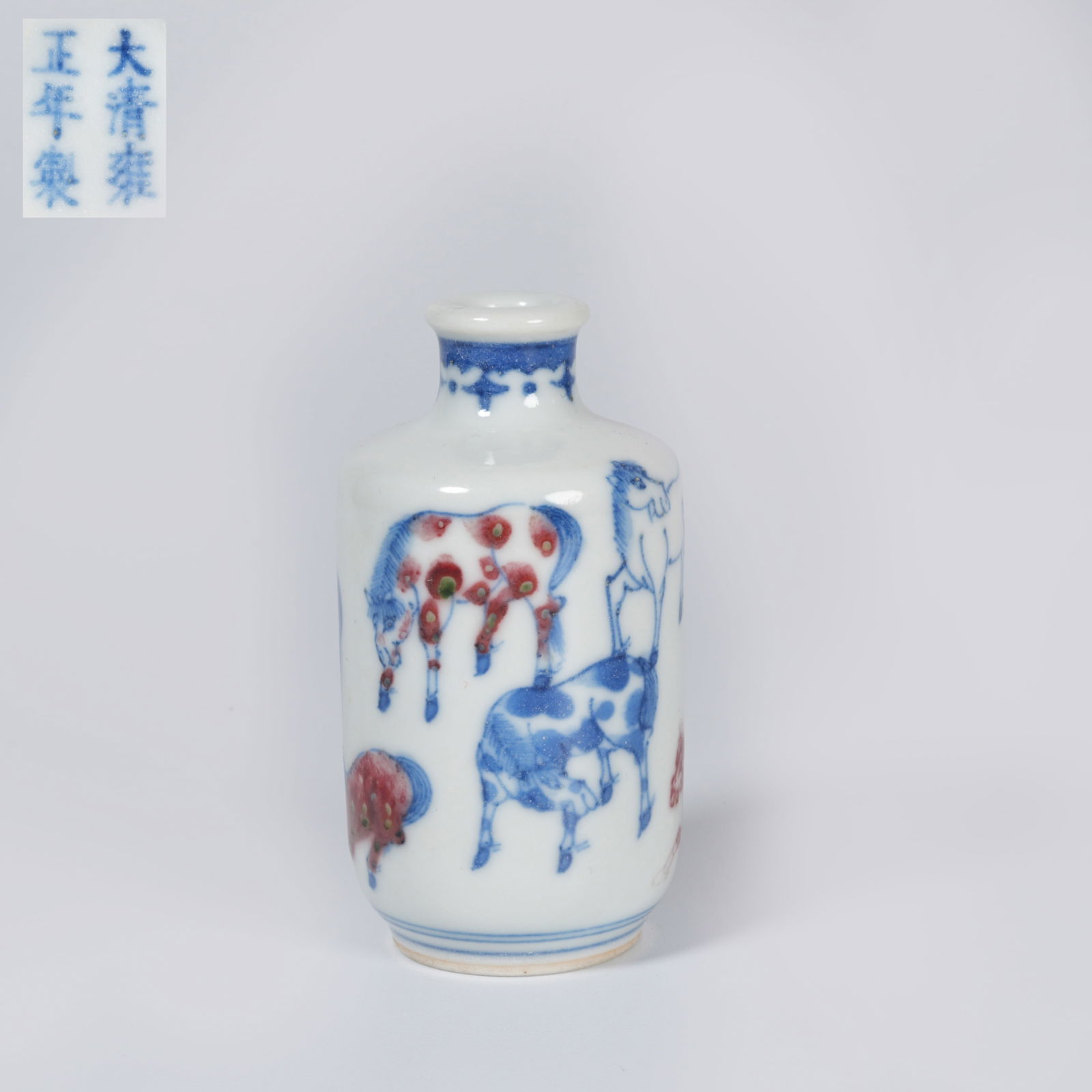 A BLUE-AND-WHITE WITH UNDERGLAZE RED "EIGHT HORSES" SNUFF BOTTLE (1 of 7)