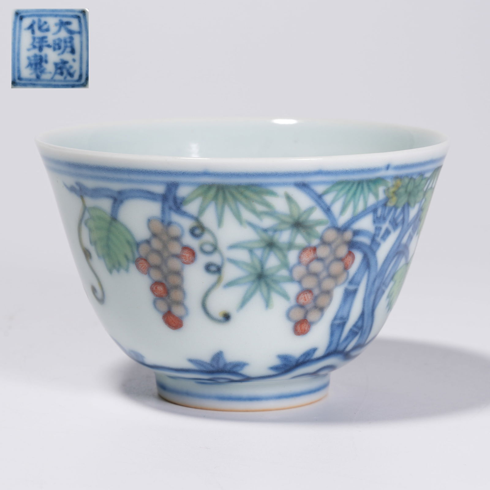 A DOUCAI GRAPE MOTIF CUP: Doucai Grape Motif Cup
