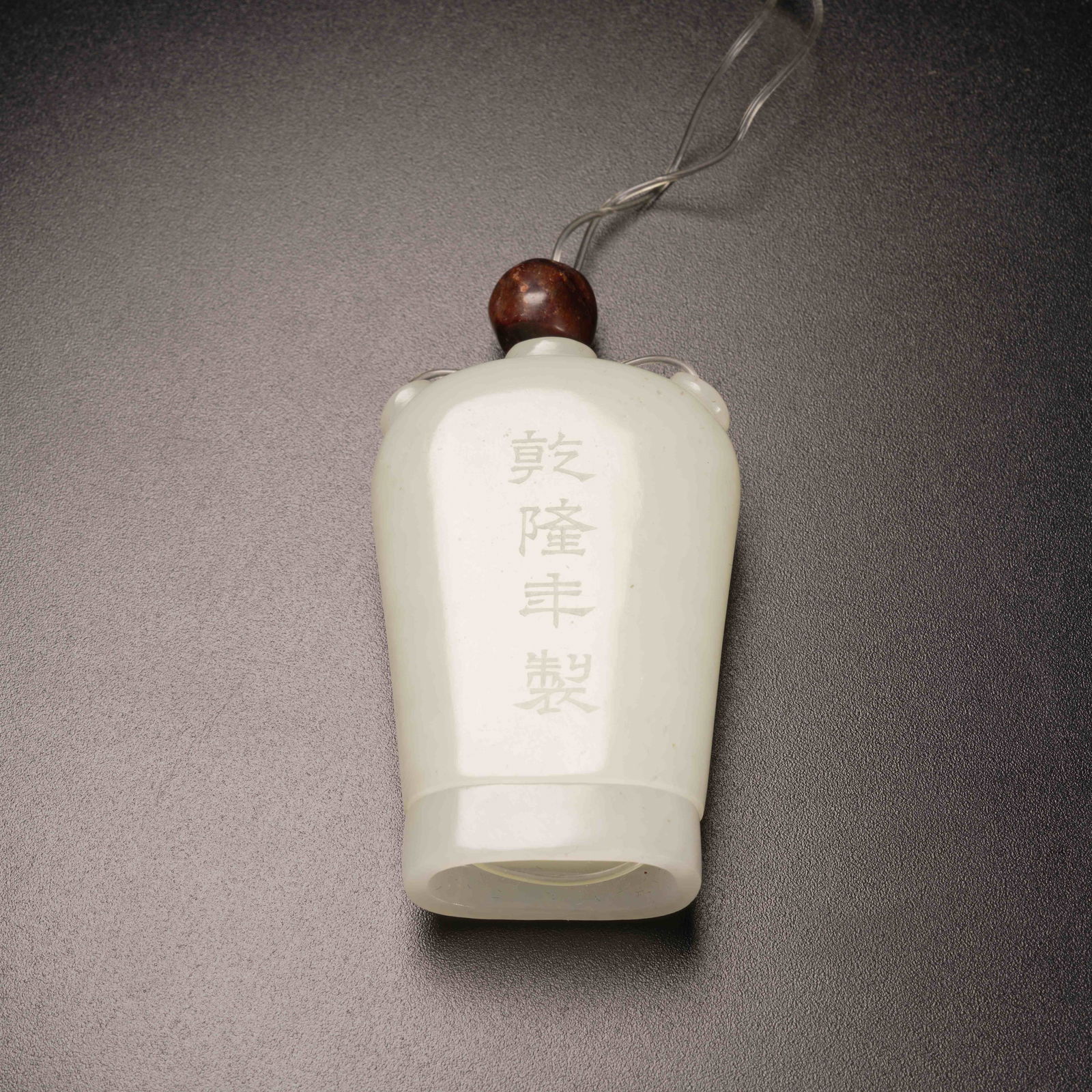 A HETIAN WHITE JADE PENDANT WITH BUDDHA IN HEART MOTIF (1 of 8)