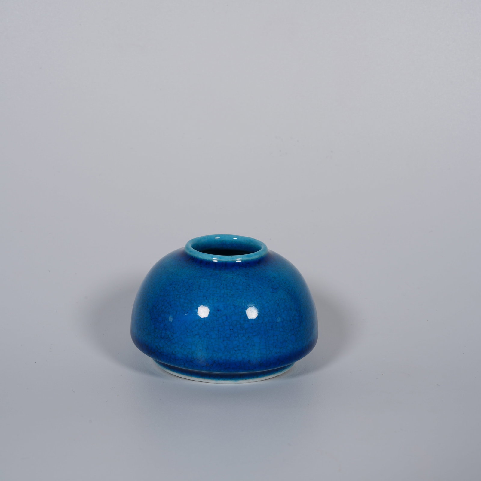A BLUE-GLAZED WATER DROPPER: Blue-glazed water dropper
