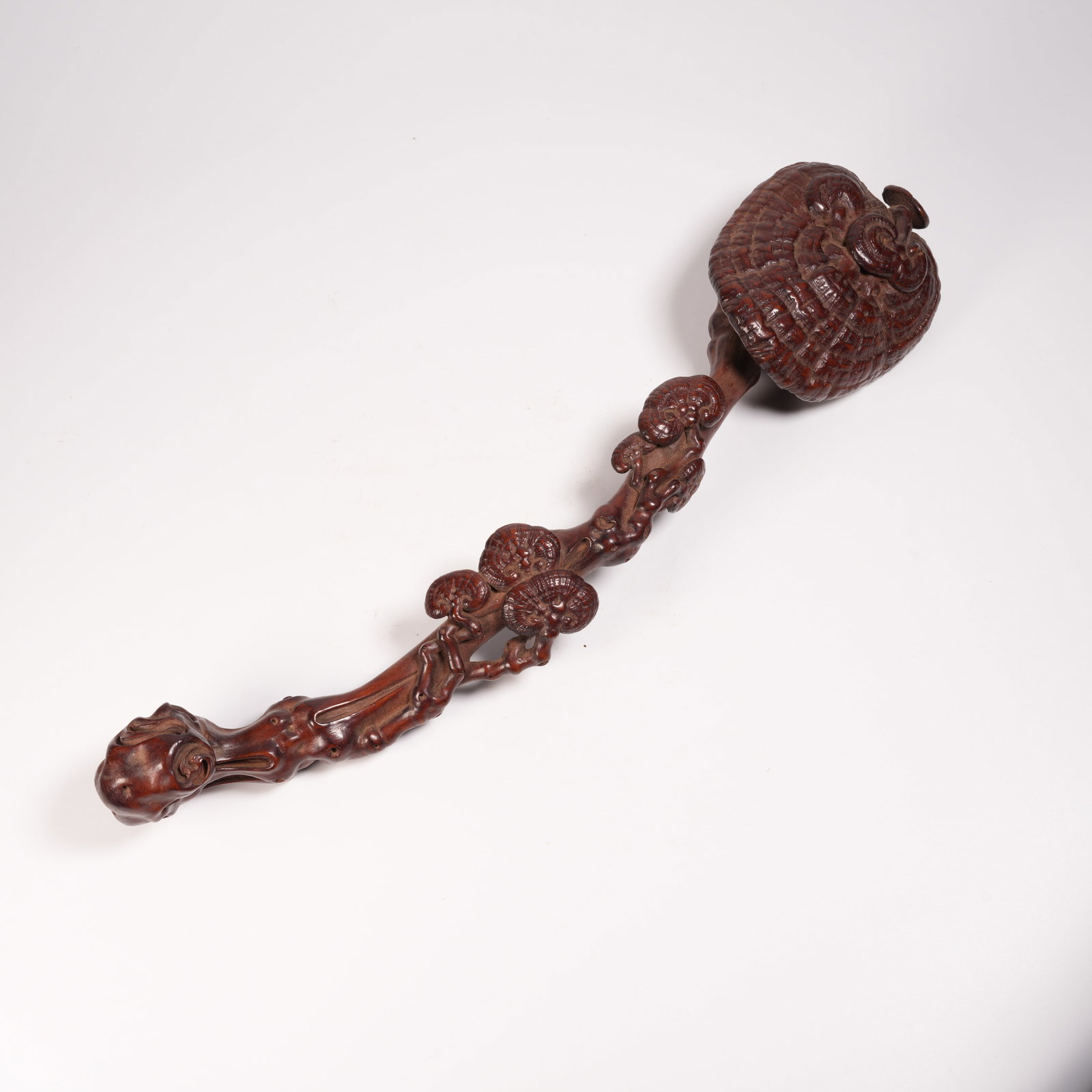 A HUANGHUALI LINGZHI RUYI ORNAMENT: Huanghuali Lingzhi Ruyi Ornament