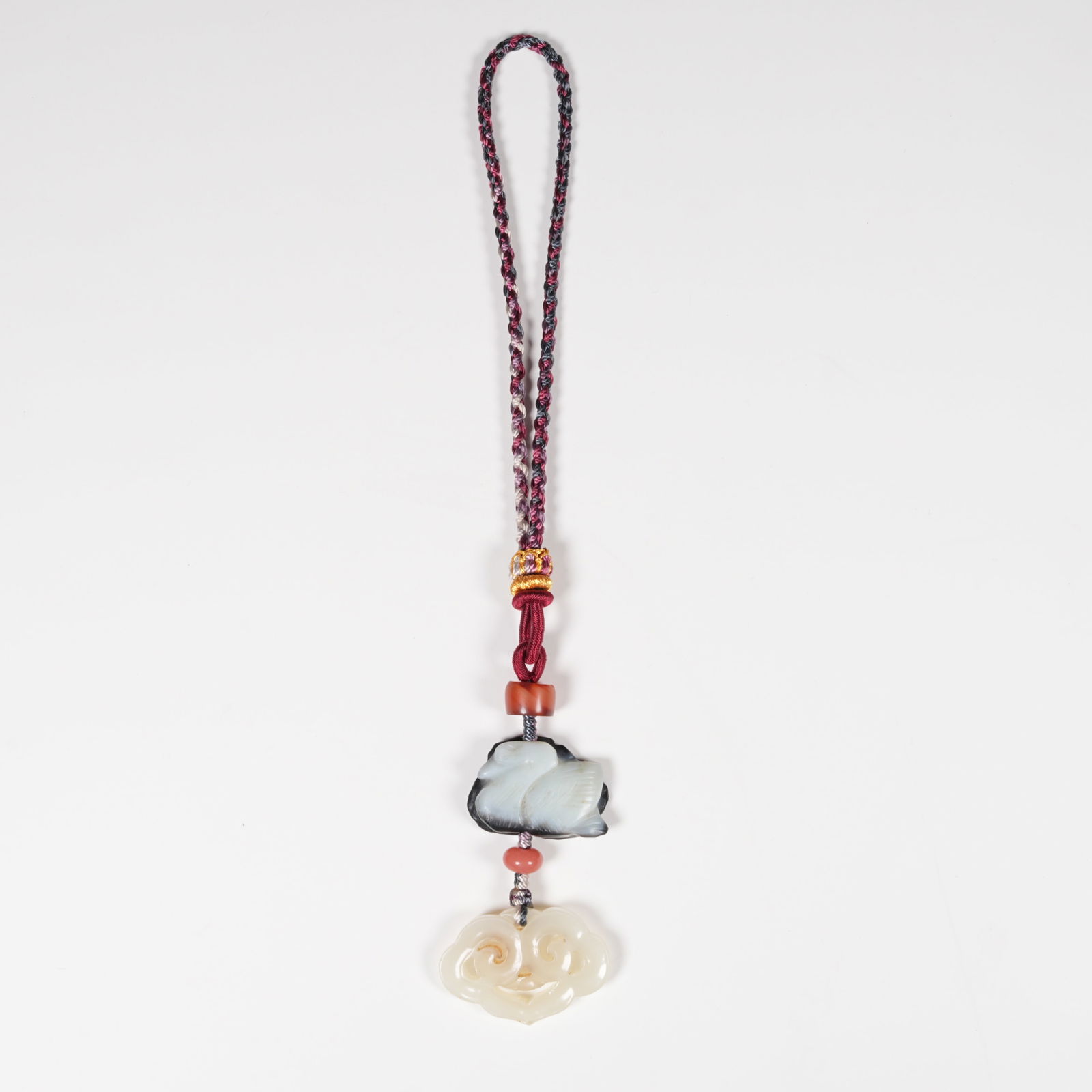 A SET OF HETIAN JADE PENDANTS WITH AUSPICIOUS CLOUD MOTIF: Set of Hetian Jade Pendants with Auspicious Cloud Motif