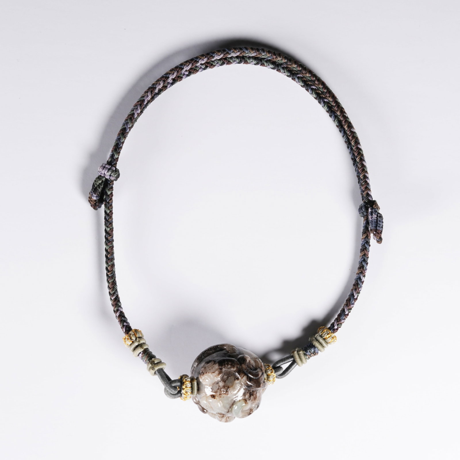 A ARCHAIC JADE PENDANT WITH BEAST MOTIF: Archaic Jade Pendant with Beast Motif