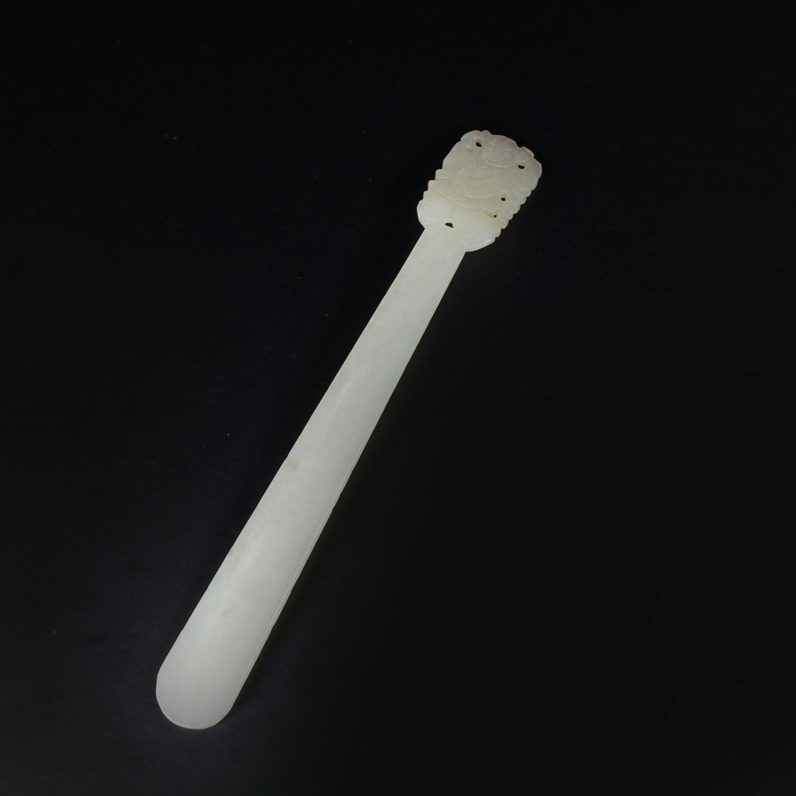 A HETIAN JADE HAIRPIN WITH BOY MOTIF: Hetian Jade Hairpin with Boy Motif