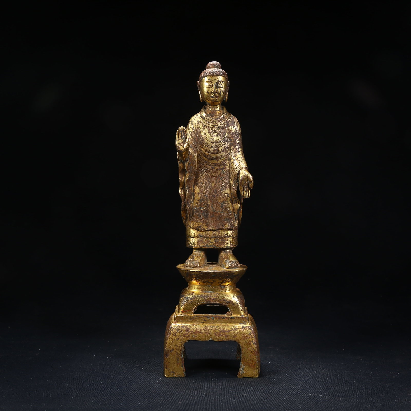 A GILT BRONZE STANDING BUDDHA STATUE (1 of 8)