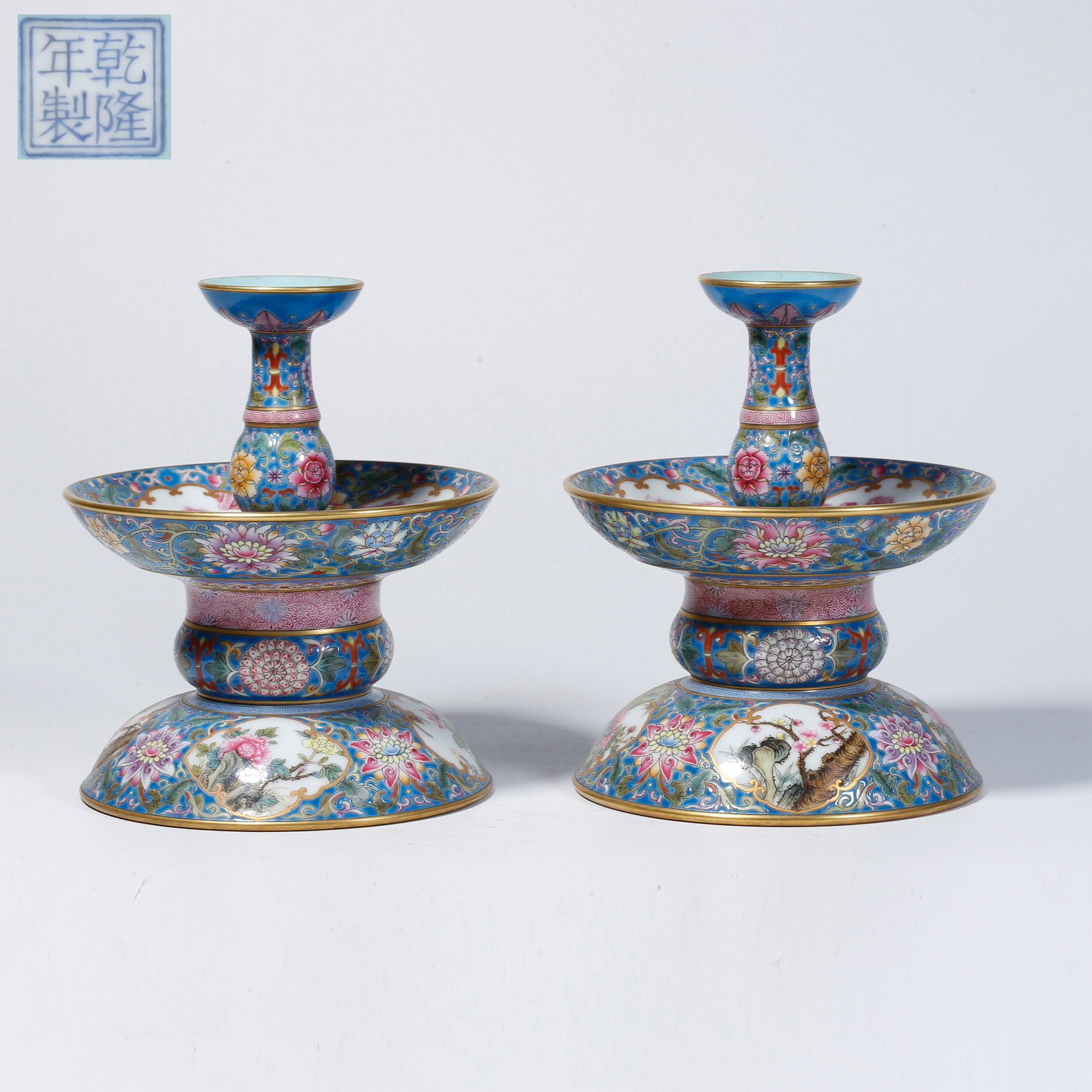 A PAIR OF FAMILLE-ROSE CANDLESTICKS WITH OPENWORK FLORAL DESIGN: Pair of famille-rose candlesticks with openwork floral design