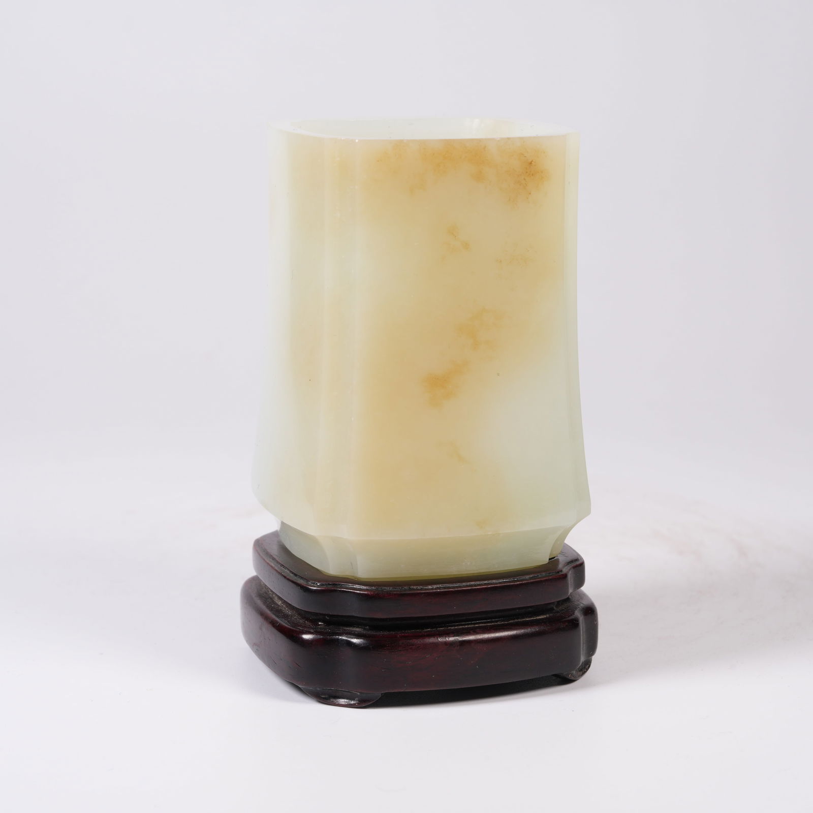 A HETIAN WHITE JADE SQUARE BRUSH POT WITH CORNER LAPPETS: Hetian white jade square brush pot with corner lappets