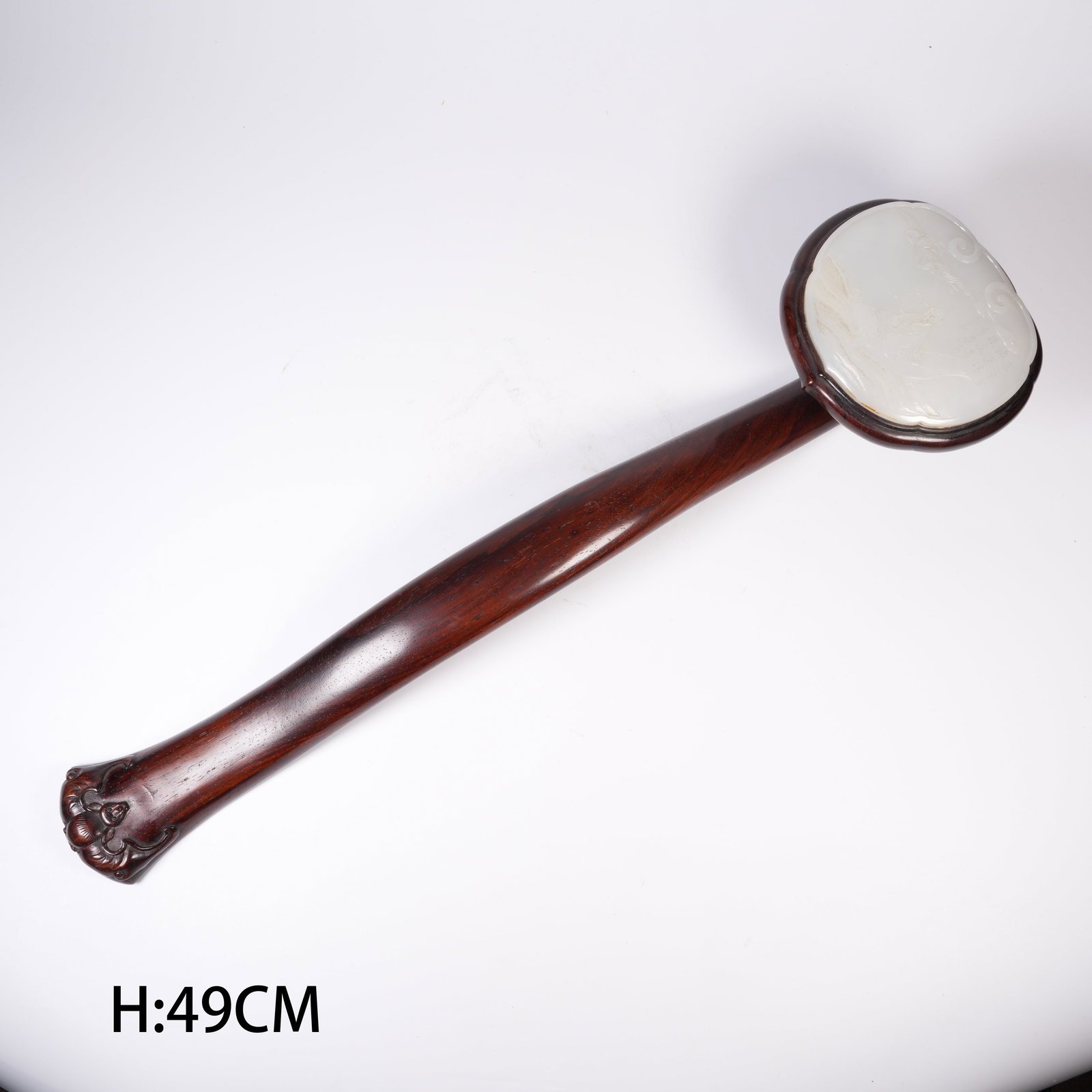 A HUANGHUALI WOOD INLAID HETIAN WHITE JADE FIGURE PENDANT IN RUYI SHAPE: Huanghuali wood inlaid Hetian white jade figure pendant in ruyi shape