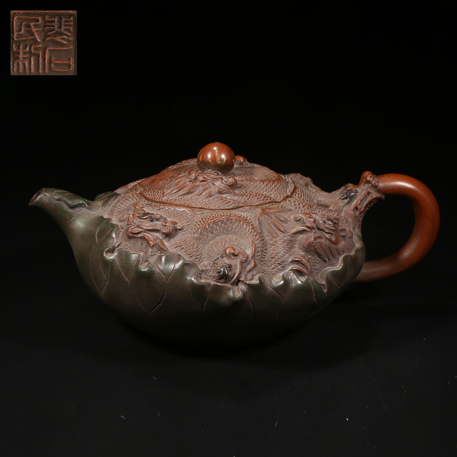 A ZISHA TEAPOT WITH NINE-DRAGON MOTIFS (1 of 9)