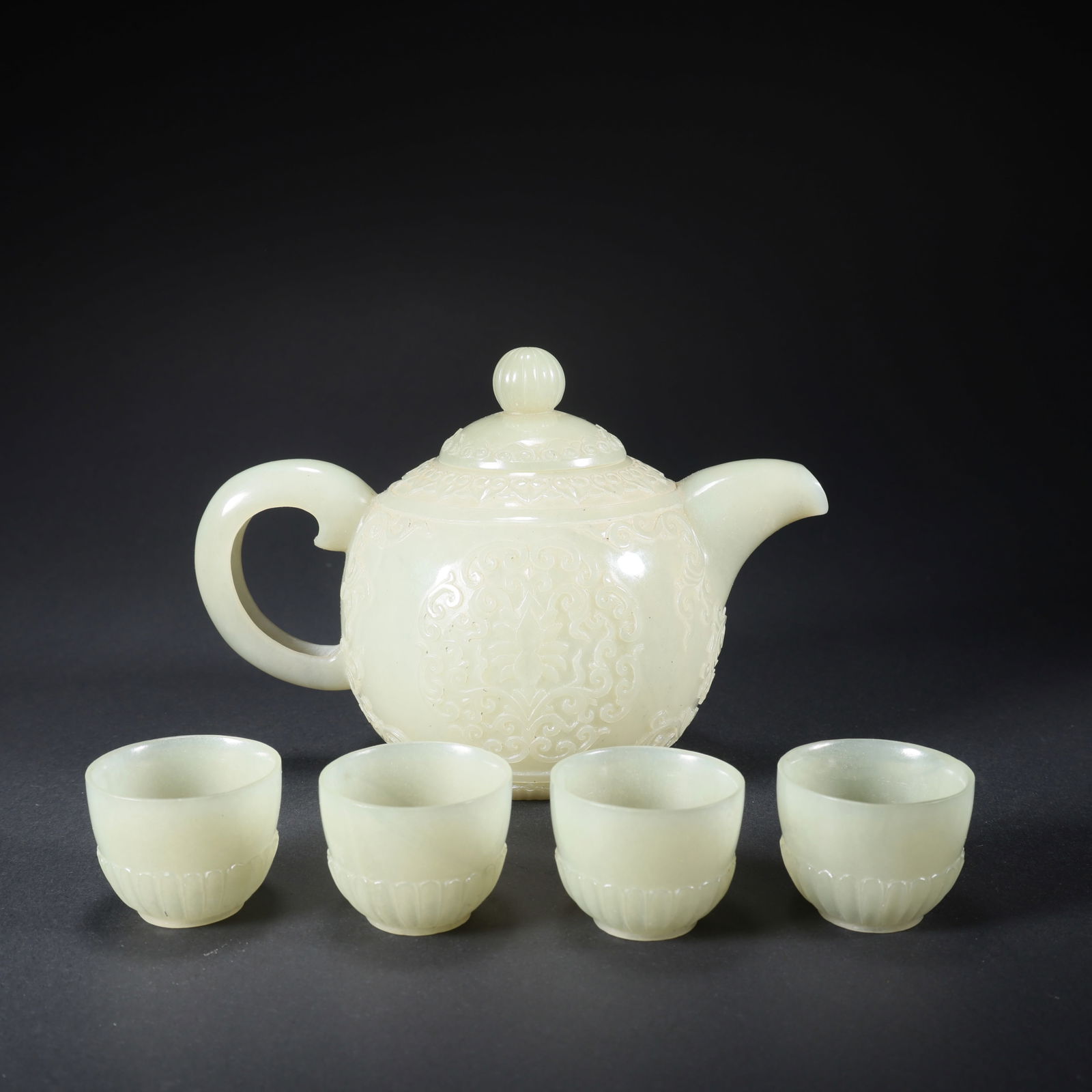 A HETIAN JADE SET OF FLOWER-AND-PLANT TEAPOTS (1 of 9)