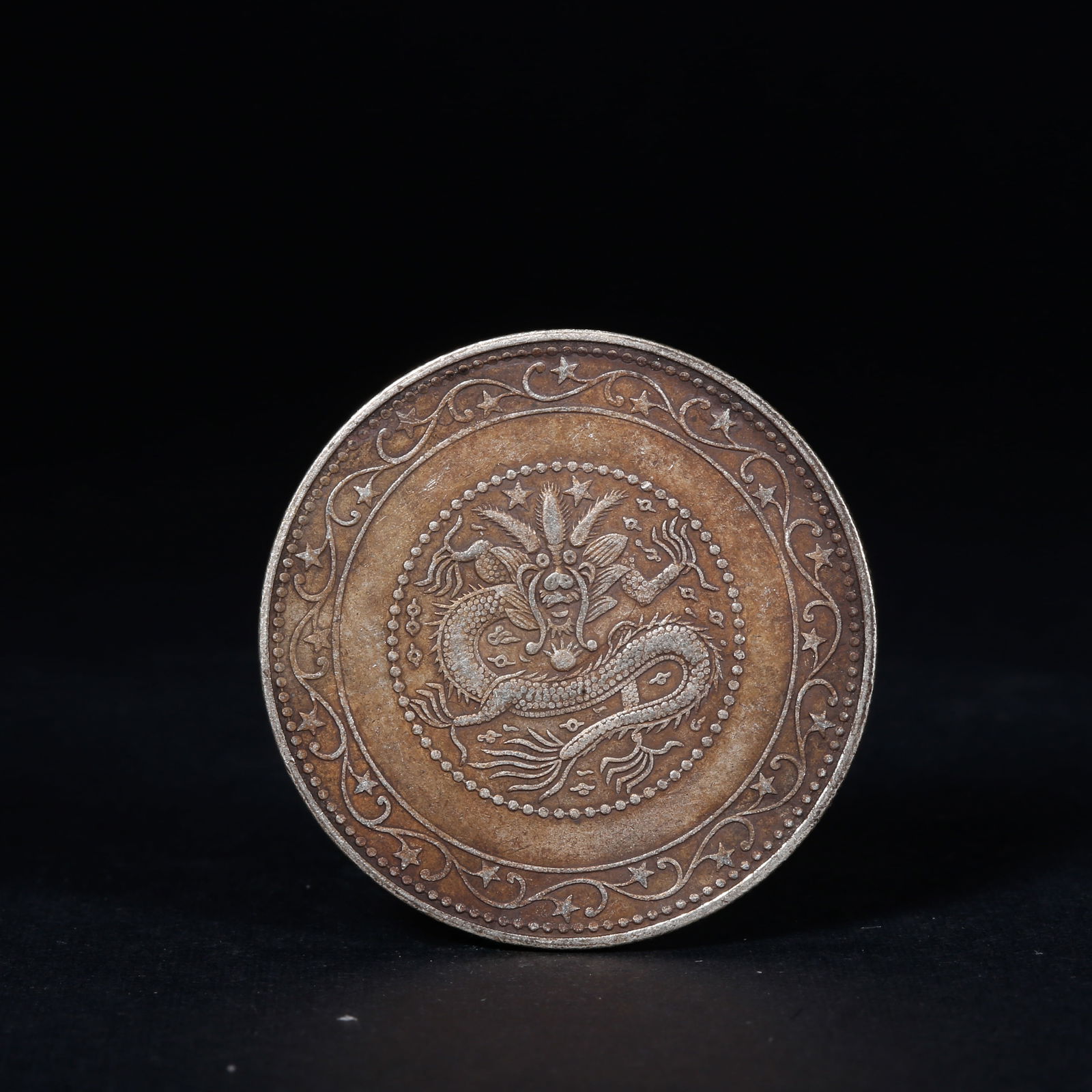 A SILVER DOLLAR COIN: One Silver dollar Coin