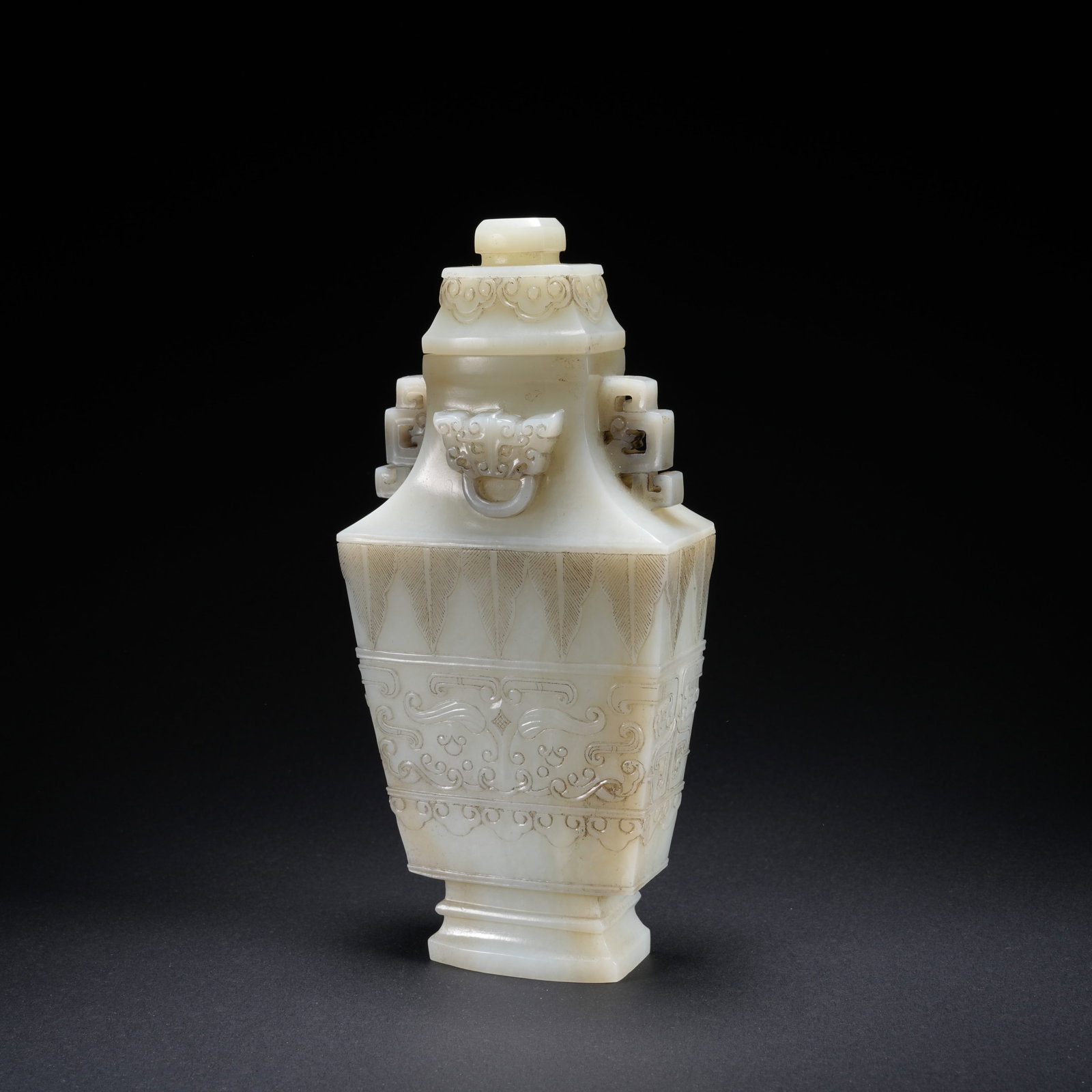 A HETIAN JADE DOUBLE-HANDLED COVERED VASE WITH BEAST-MASK MOTIF (1 of 8)