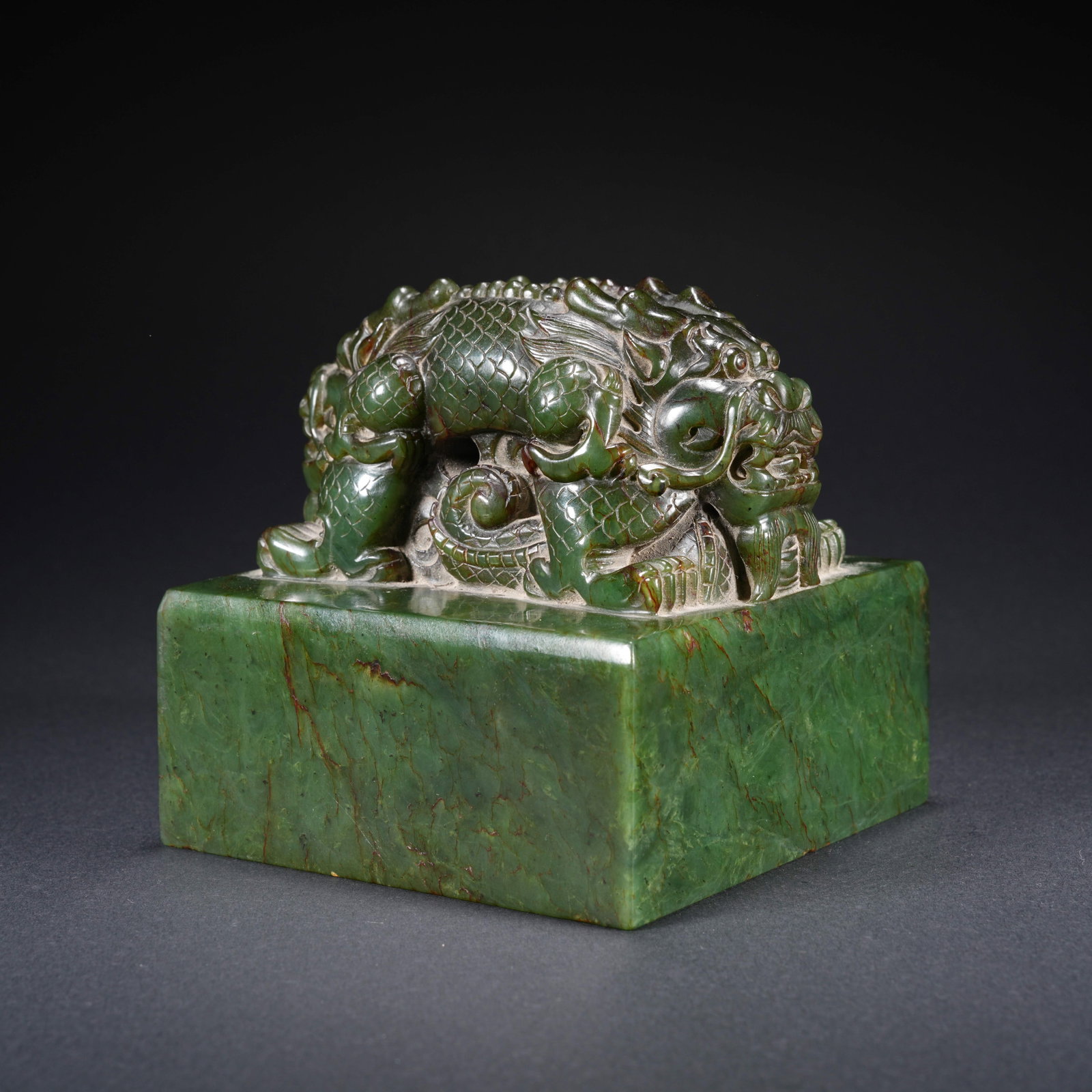 A HETIAN SPINACH GREEN JADE CARVED SEAL WITH DOUBLE-DRAGON FINIAL (1 of 9)