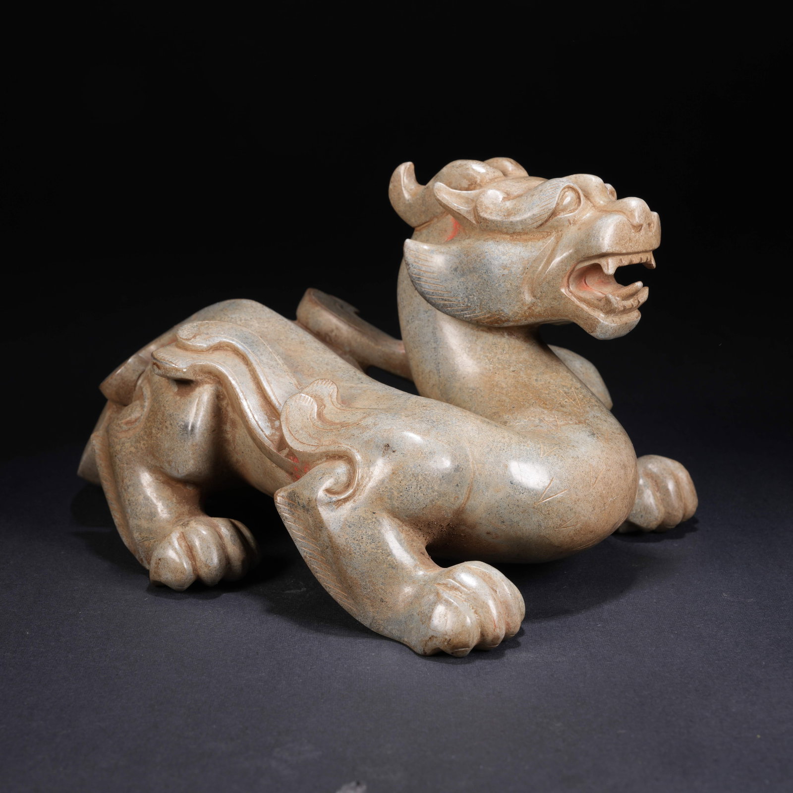 A ANCIENT JADE AUSPICIOUS BEAST FIGURINE (1 of 8)