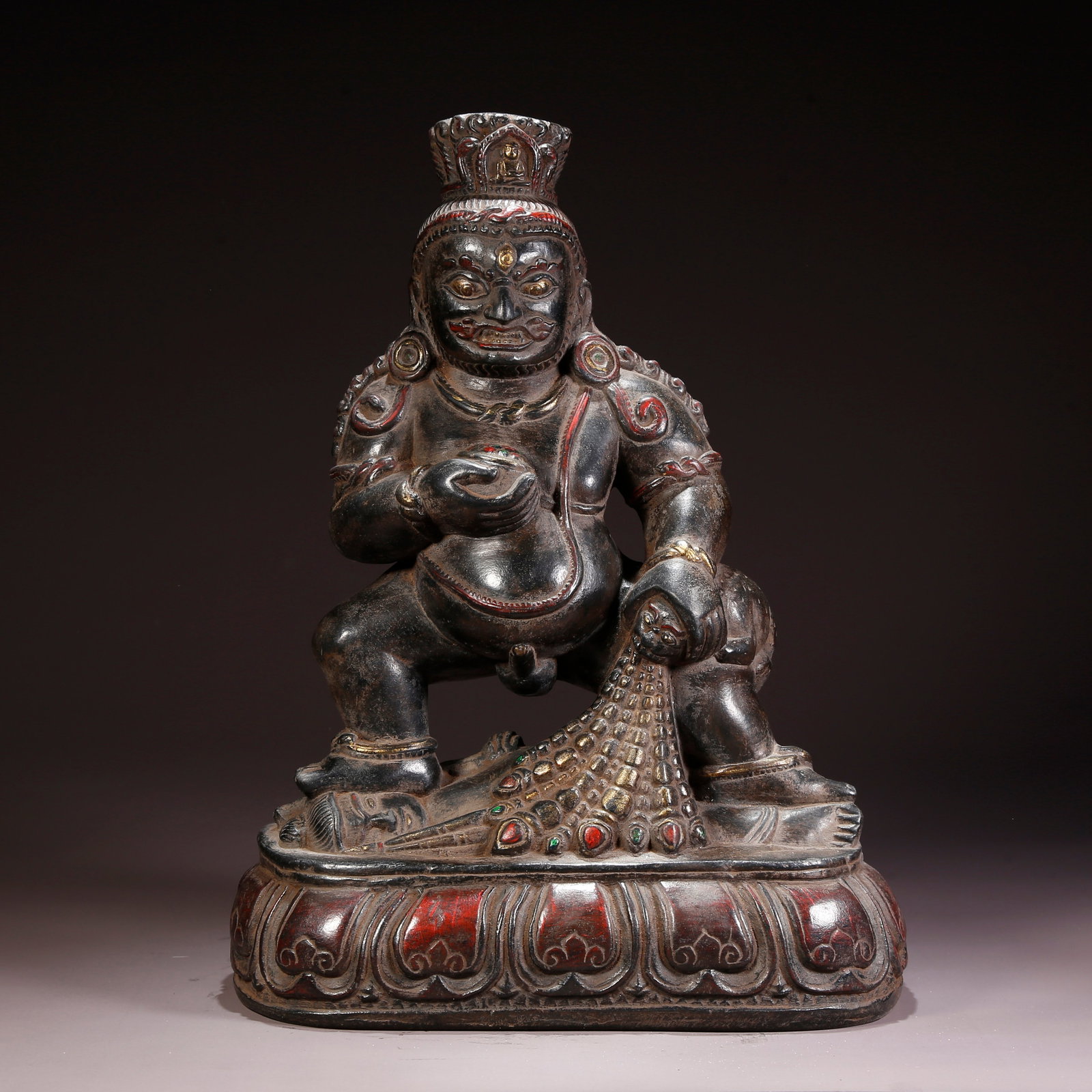 A BLACK STONE BLACK JAMBHALA FIGURE (1 of 9)