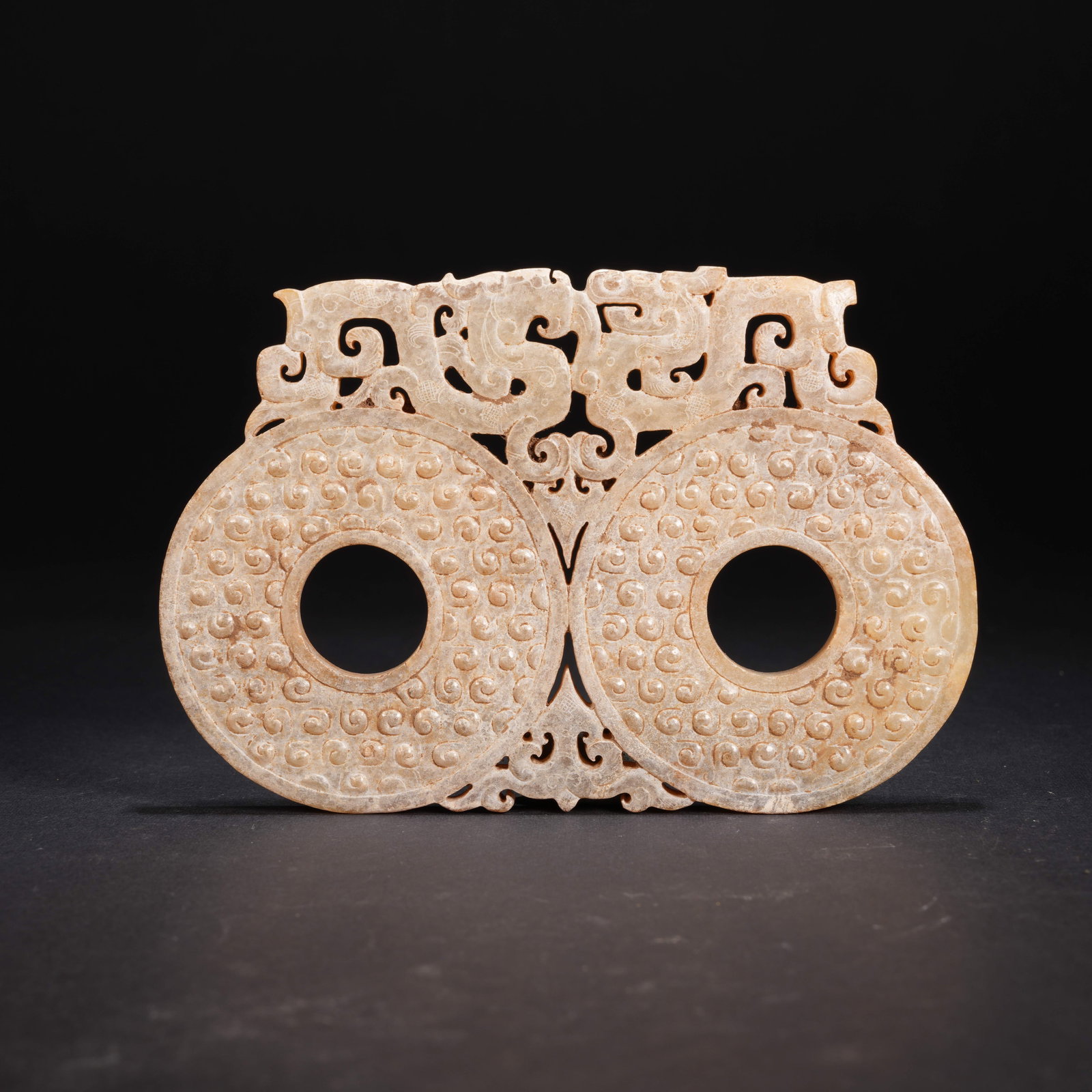 A ANCIENT JADE EXPANDED BI DISK WITH DRAGON MOTIF (1 of 8)