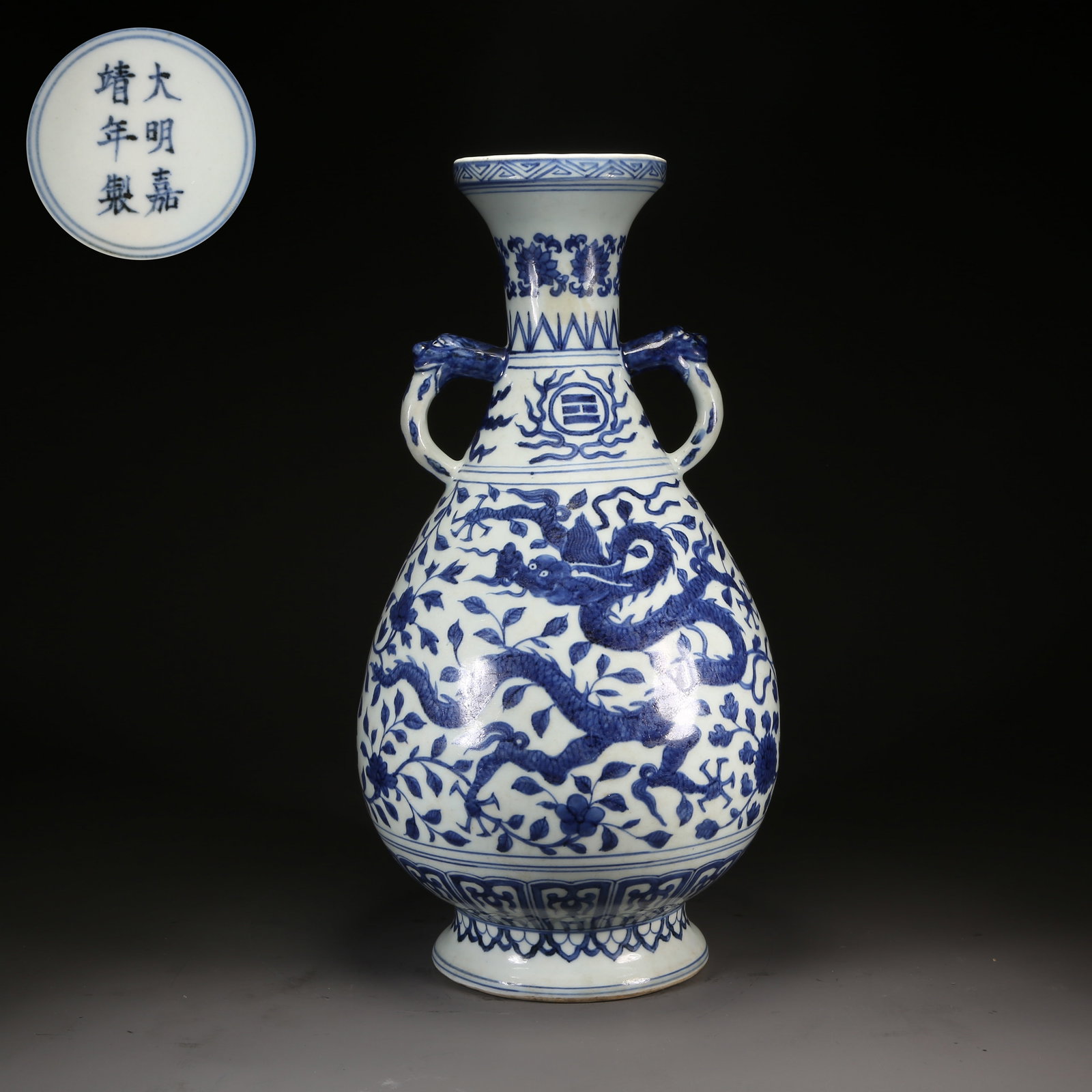 A BLUE-AND-WHITE BEAST-HANDLED DISH-MOUTH VASE WITH DRAGON AMONG FLOWERS MOTIF (1 of 9)