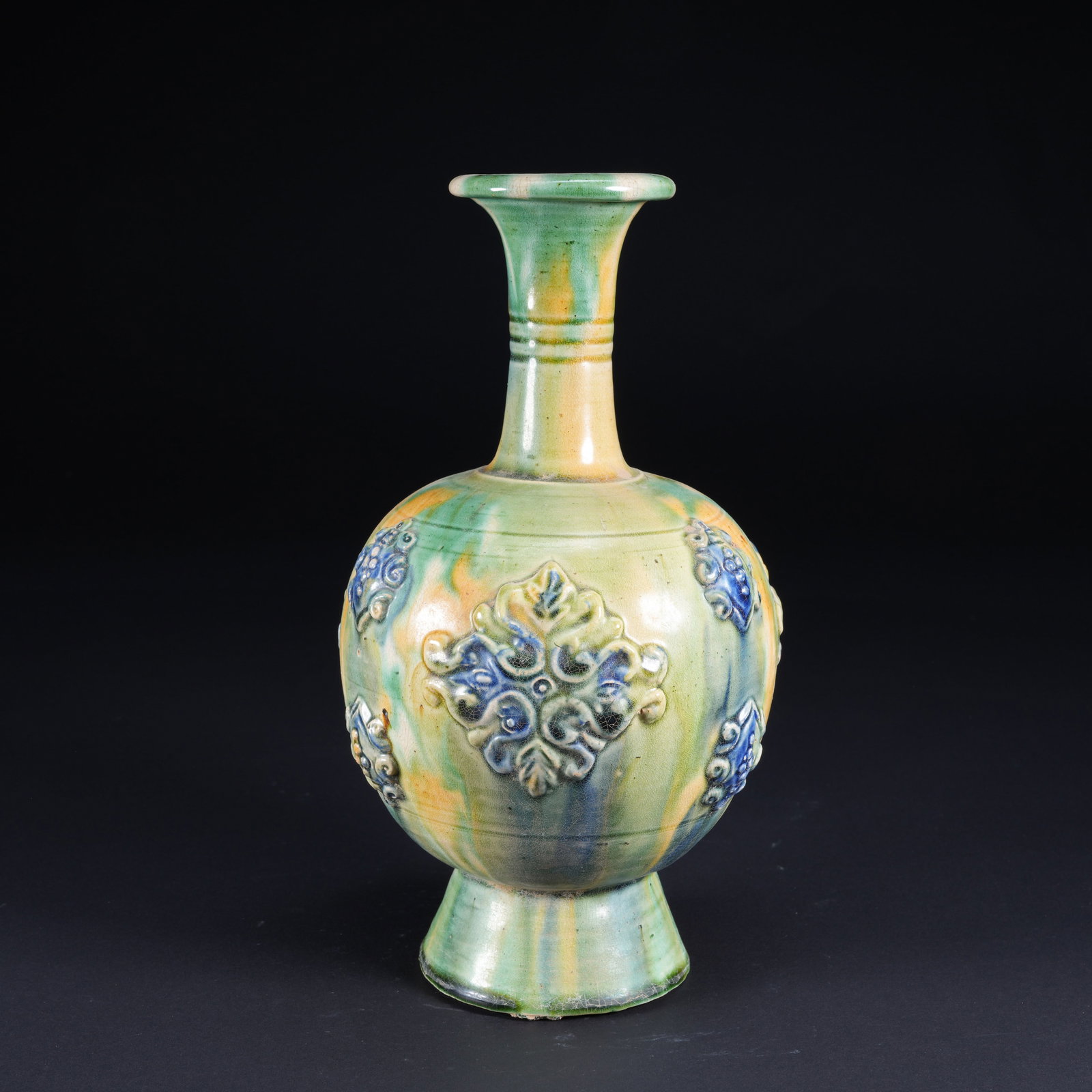 A TANG SANCAI CARVED LONG-NECK BOTTLE WITH FLARED MOUTH (1 of 9)