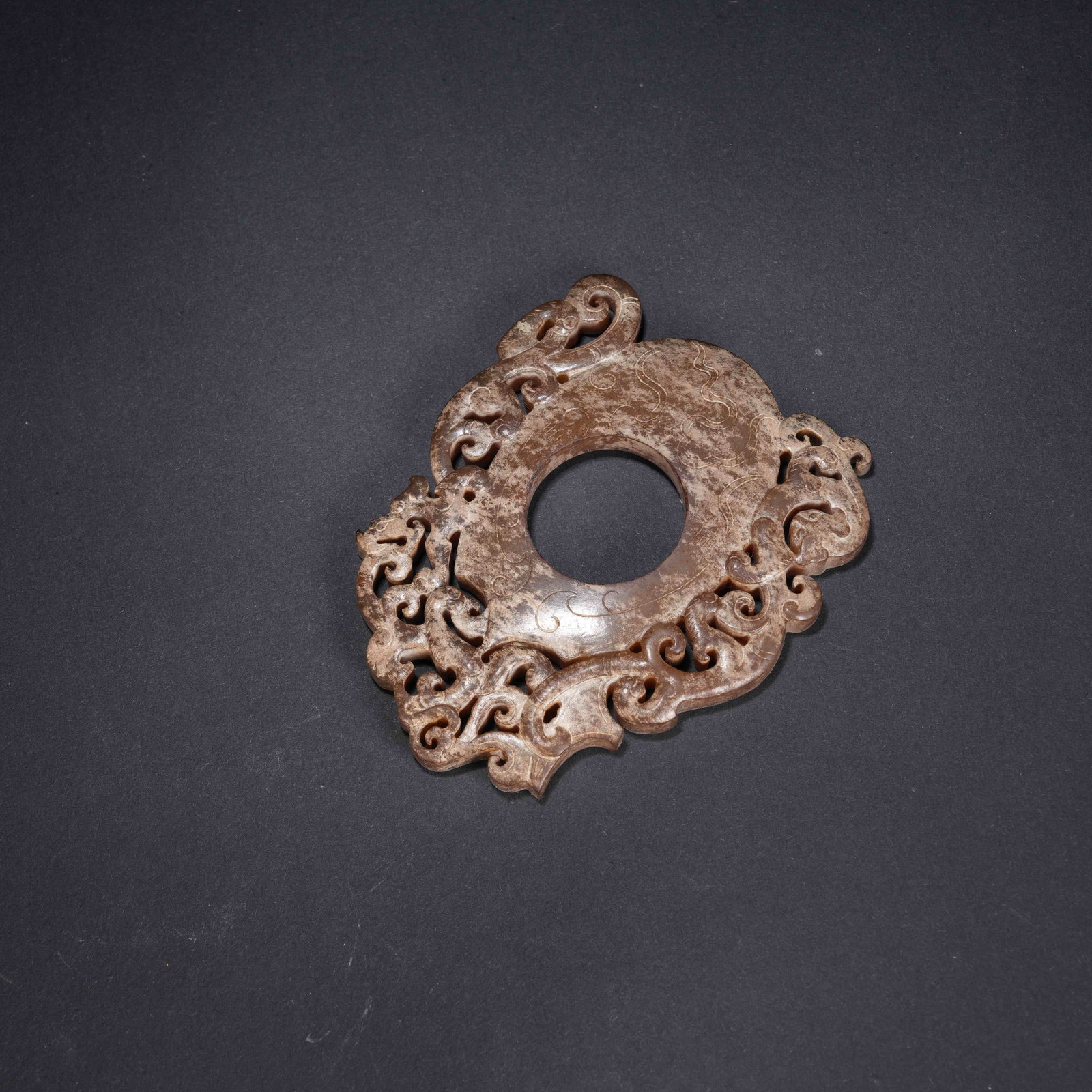 A ANCIENT JADE CHICKEN-HEART PENDANT WITH CHI DRAGON MOTIF (1 of 10)