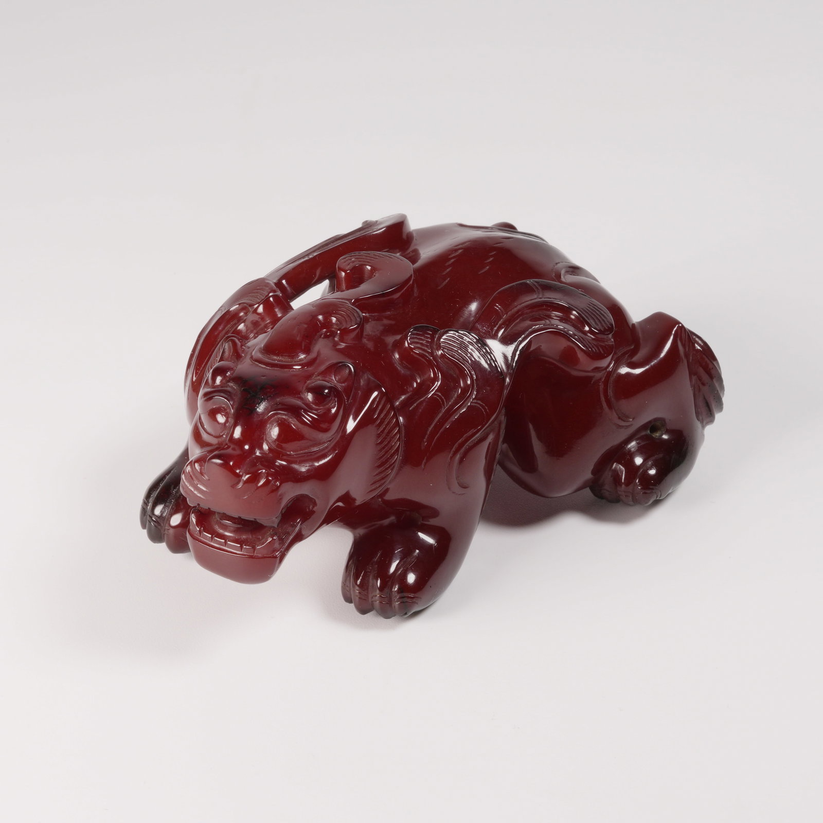 A HONEY-AMBER GUARDIAN FIGURE (1 of 8)