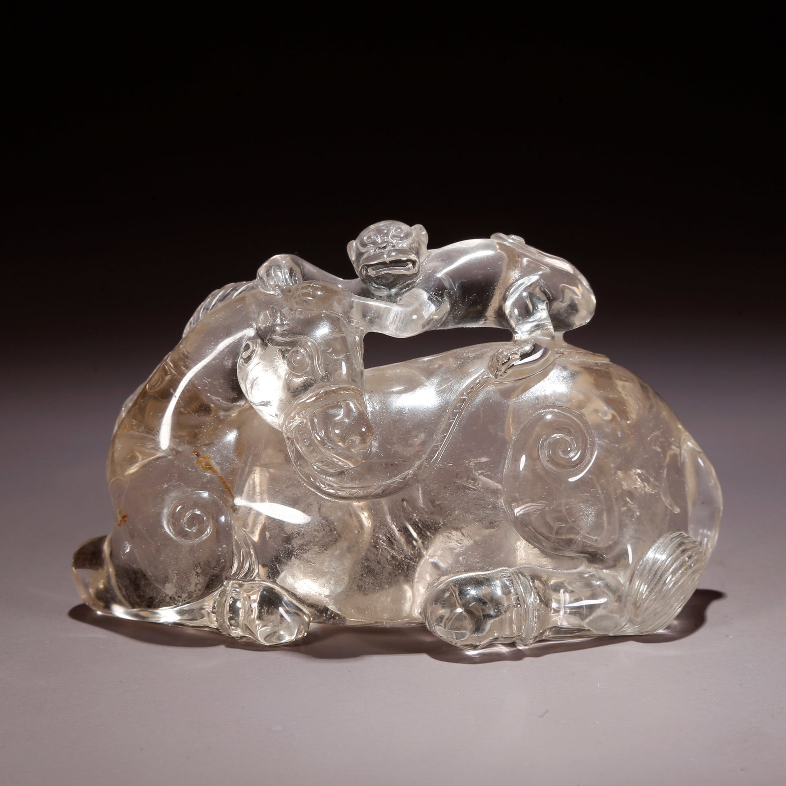 A CRYSTAL CARVED "SEALING RANK ON HORSEBACK" FIGURINE (1 of 10)