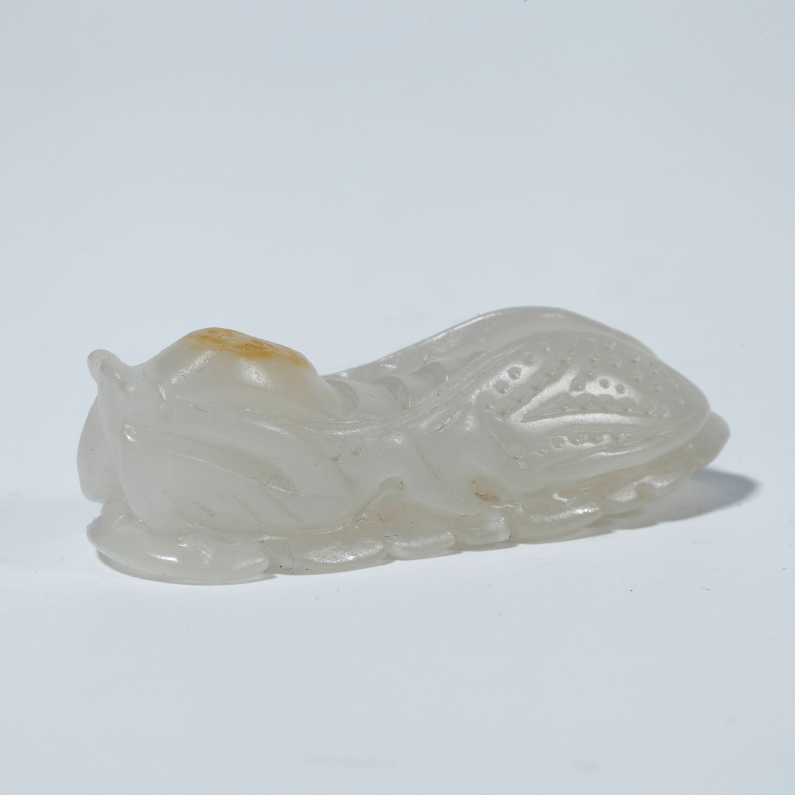 A HETIAN JADE FIGURINE "ASTONISHING AT FIRST SOUND" (1 of 10)