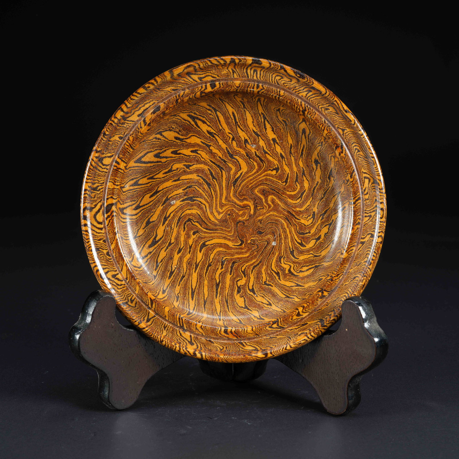 A MARBLED CLAY SMALL FOLDED-RIM PLATE: Marbled Clay Small Folded-Rim Plate