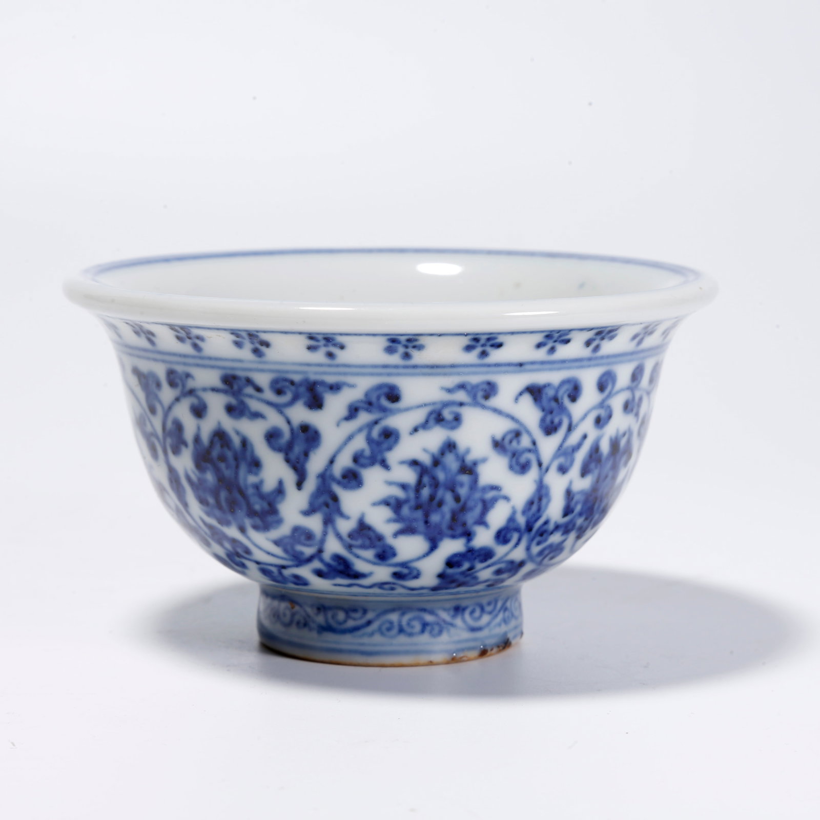 A BLUE-AND-WHITE BOWL WITH INTERTWINED FLOWER PATTERN (1 of 8)
