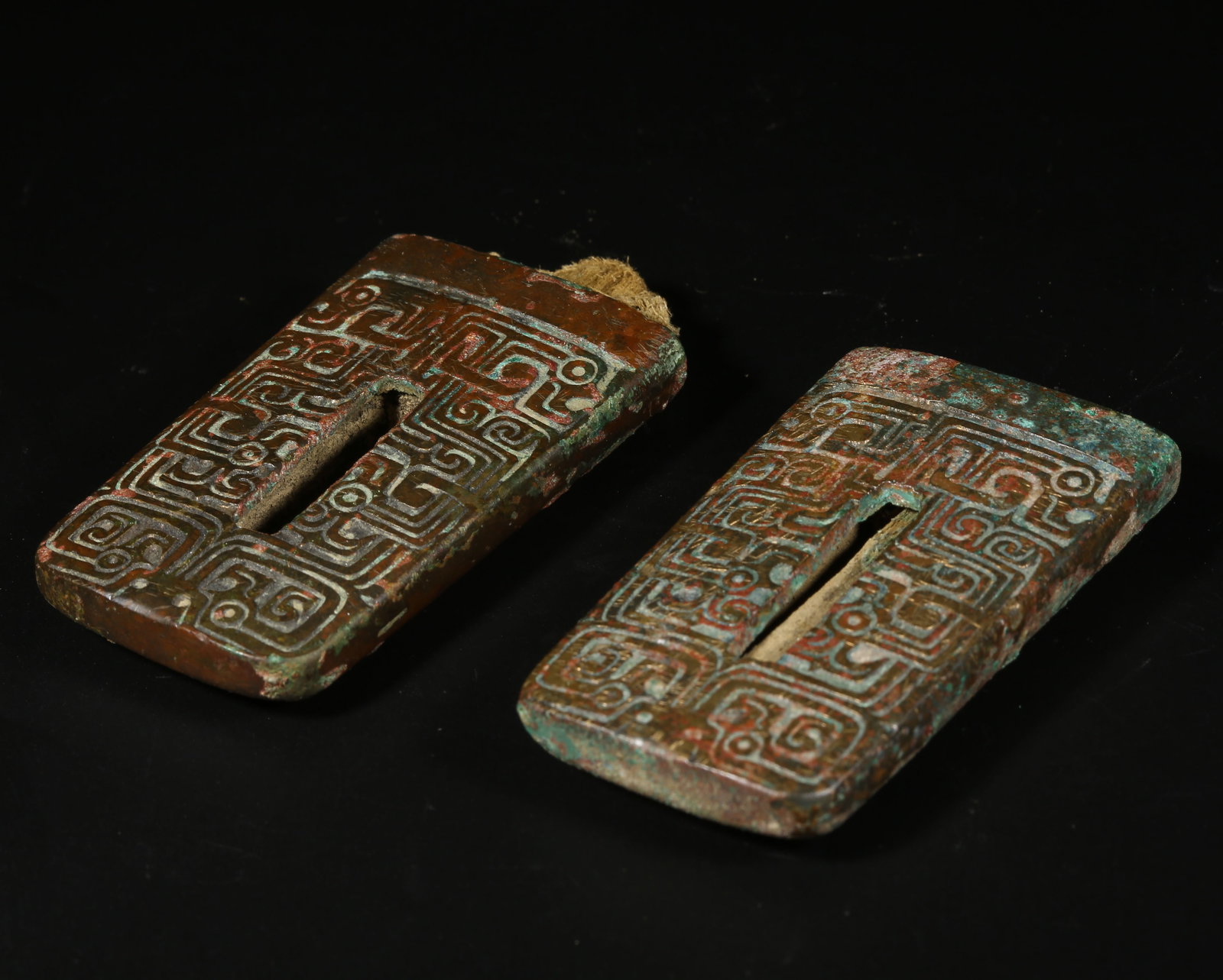 A BRONZE BEAST-FACE SWORD GUARD SET (1 of 10)