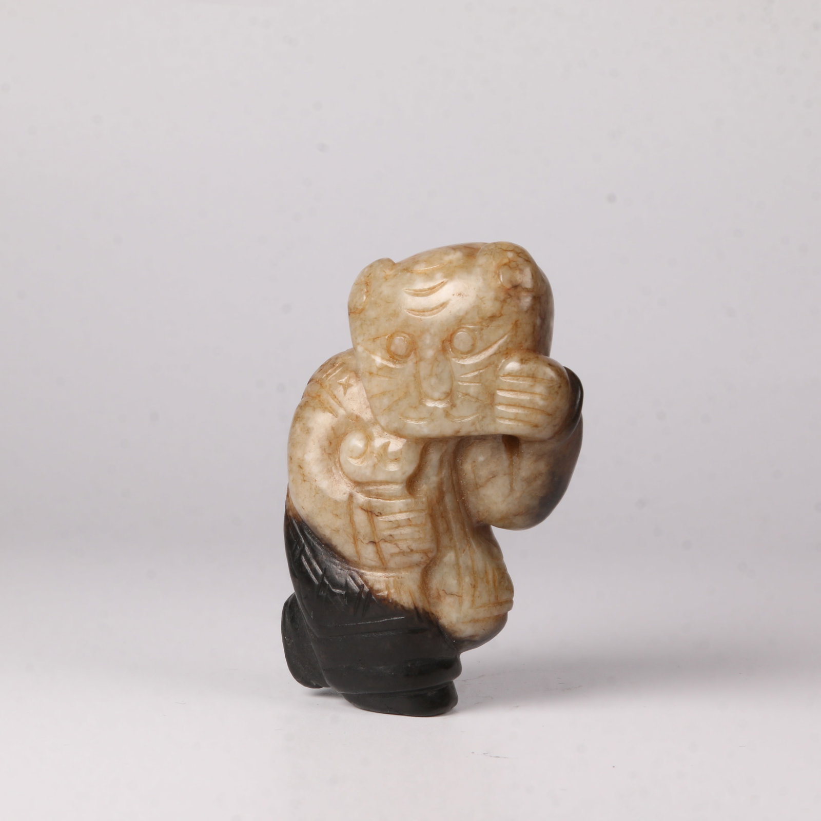 A HETIAN JADE FIGURE ORNAMENT (1 of 8)