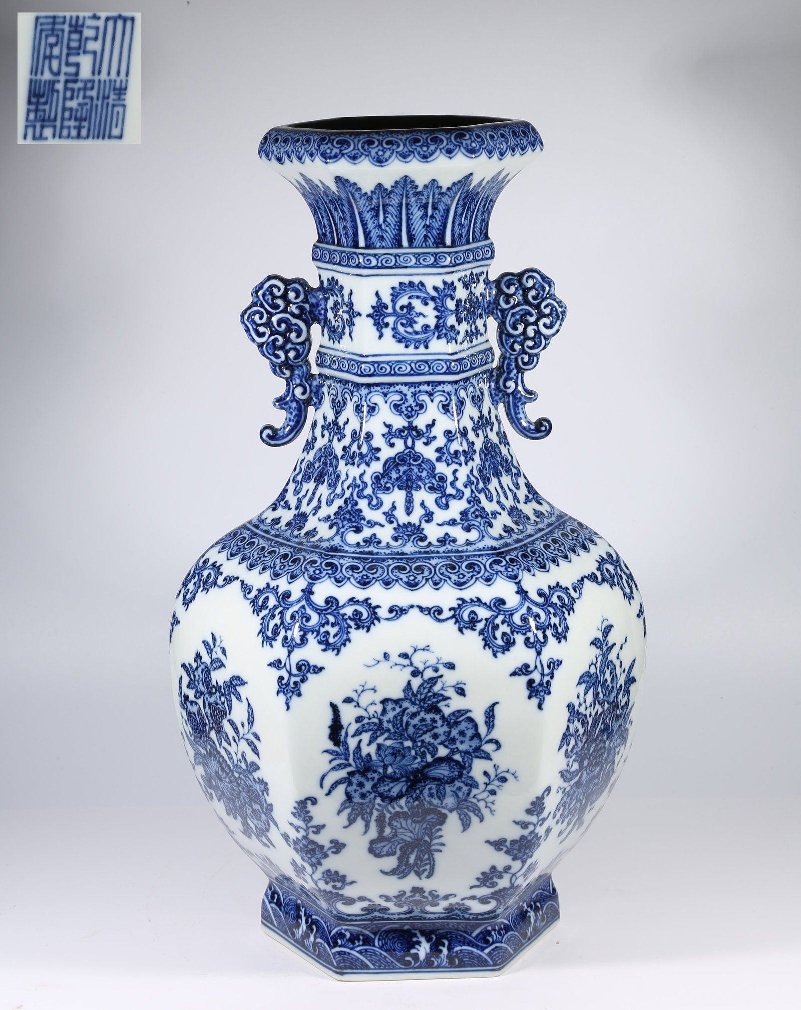 A BLUE-AND-WHITE HEXAGONAL DOUBLE-HANDLED VASE WITH FLORAL AND FRUIT MOTIFS (1 of 10)