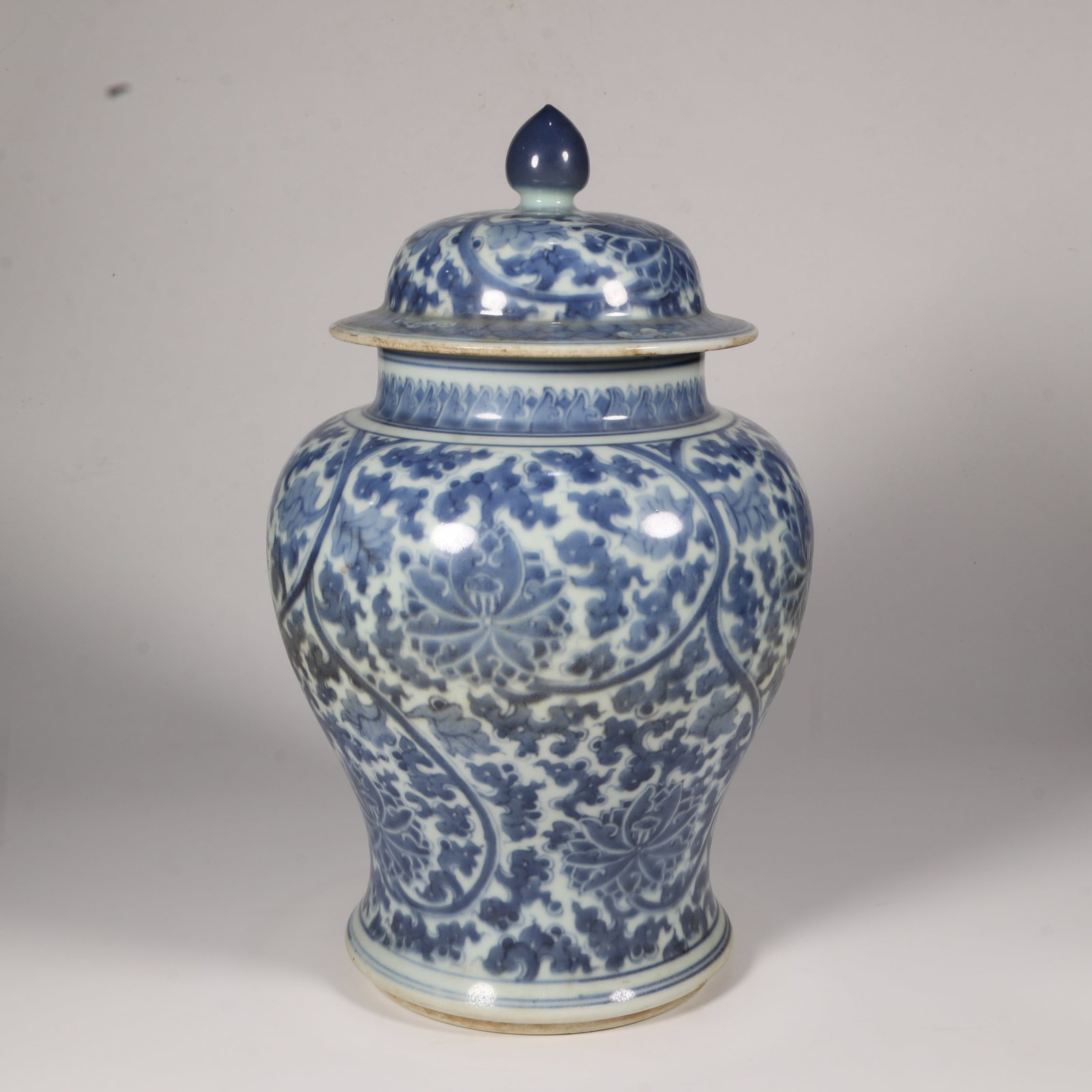 A BLUE-AND-WHITE GENERAL'S JAR WITH INTERTWINED FLORAL MOTIF (1 of 11)