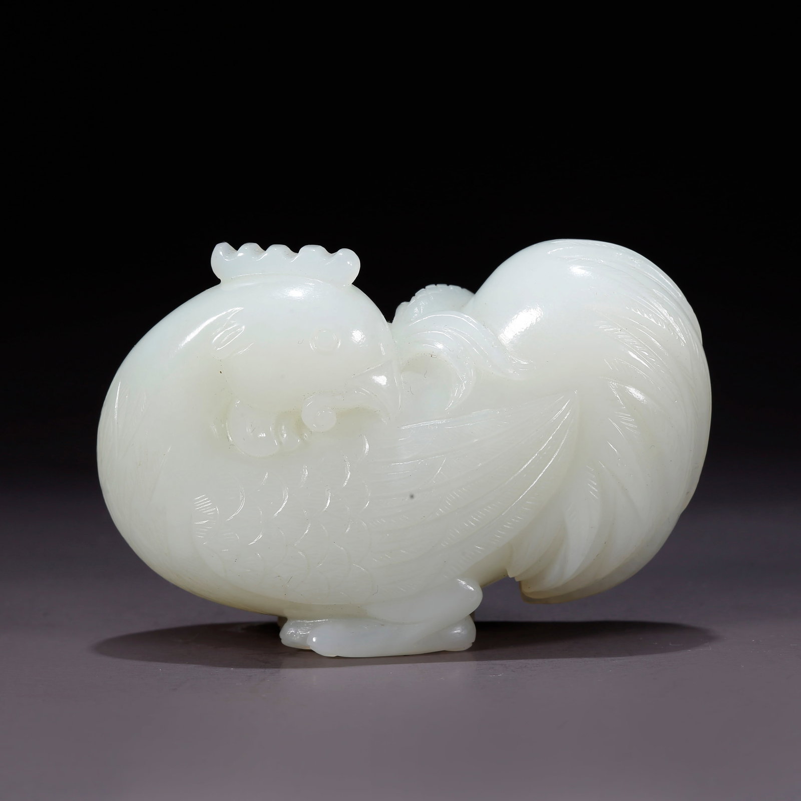 A HETIAN JADE ROOSTER-SHAPED FIGURINE (1 of 10)