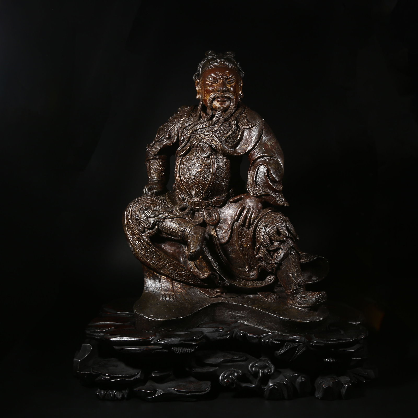 A BRONZE GILT-LACQUERED SEATED FIGURE OF GUAN GONG (1 of 8)