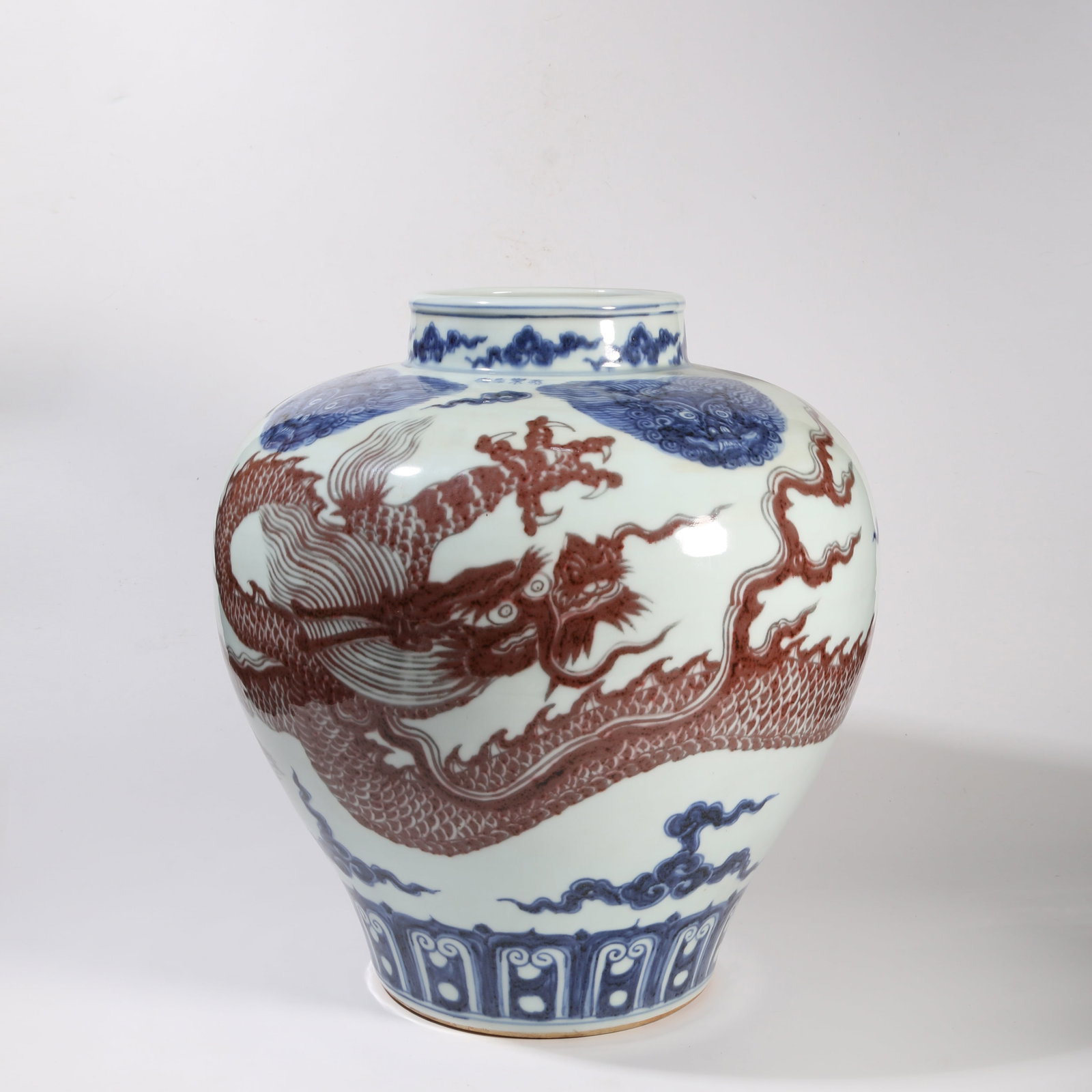 A BLUE-AND-WHITE UNDERGLAZE RED PRUNUS VASE WITH CLOUD AND DRAGON MOTIF (1 of 15)