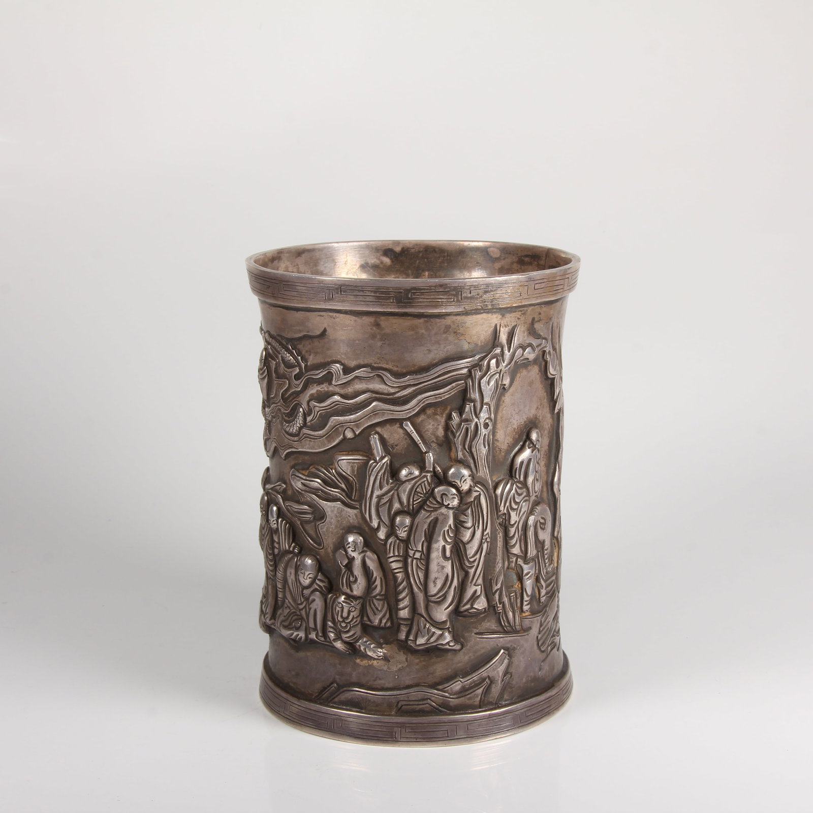 A SILVER BRUSH POT WITH EIGHTEEN ARHATS MOTIF (1 of 14)