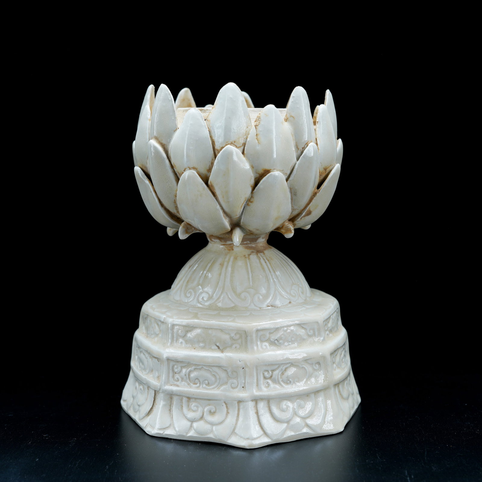 A WHITE GLAZED LOTUS-SHAPED CANDLESTICK (1 of 9)