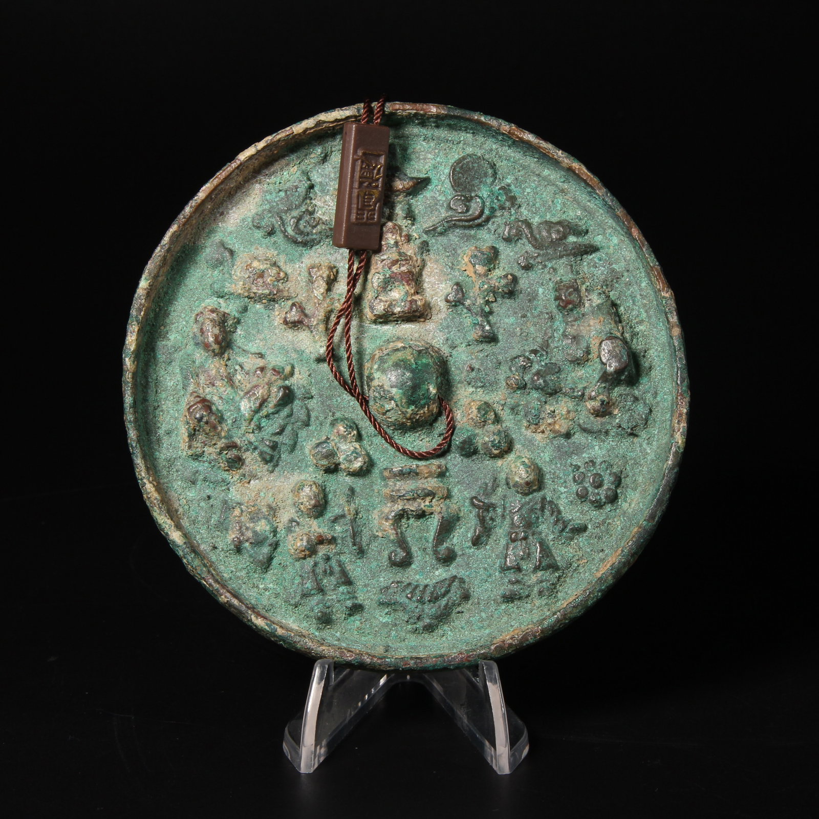 A BRONZE MIRROR WITH FIGURAL AND TREASURE MOTIFS (1 of 15)