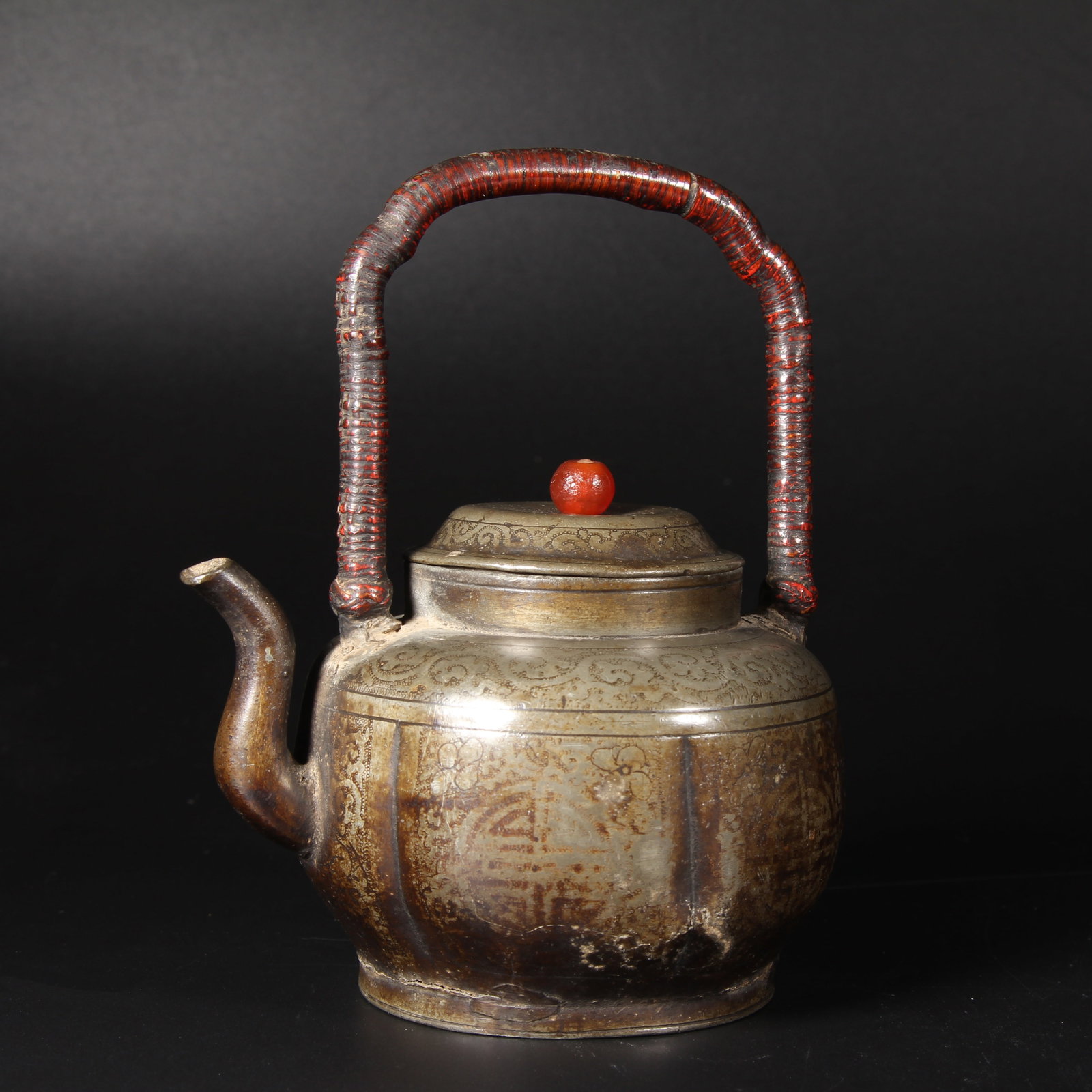 A PEWTER TEAPOT WITH FLORAL DESIGN AND SWING HANDLE (1 of 10)
