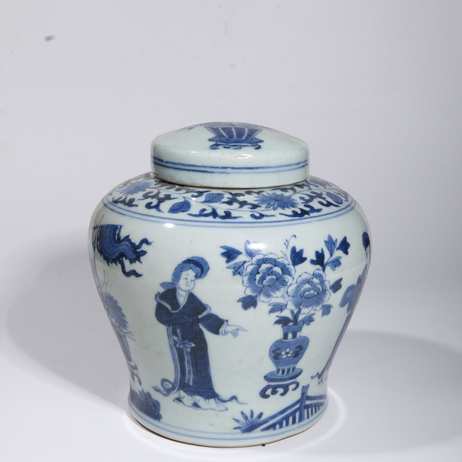 A BLUE-AND-WHITE COVERED JAR WITH FIGURES AND FLORAL MOTIF (1 of 11)