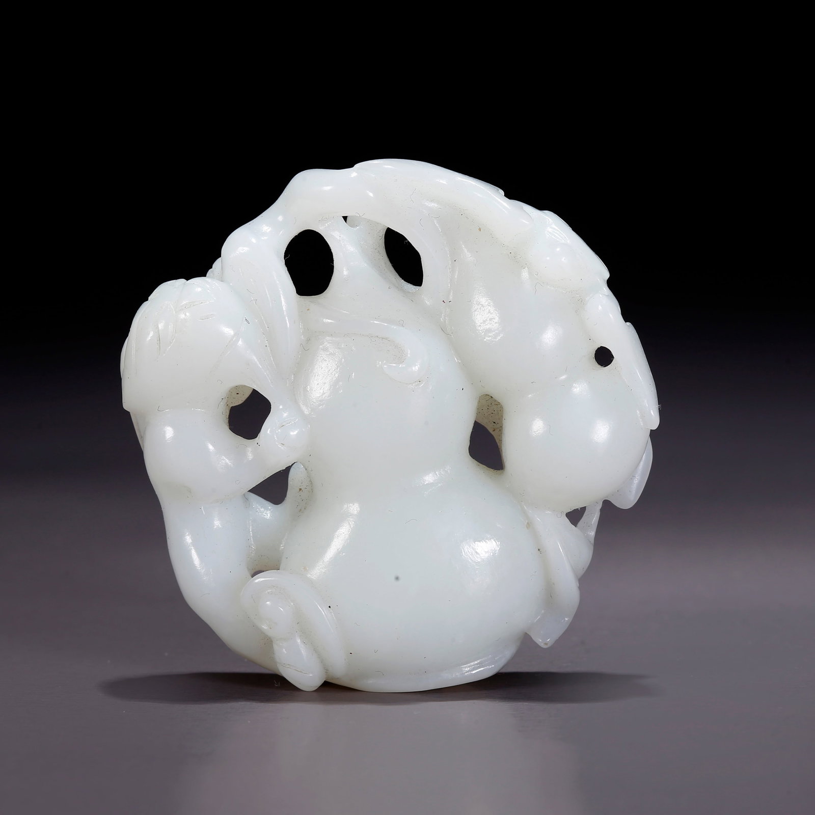 A HETIAN JADE GOURD-SHAPED FIGURINE (1 of 9)