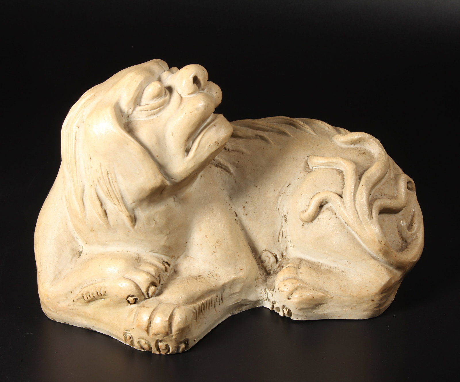 A UNGLAZED PORCELAIN LION FIGURE (1 of 11)