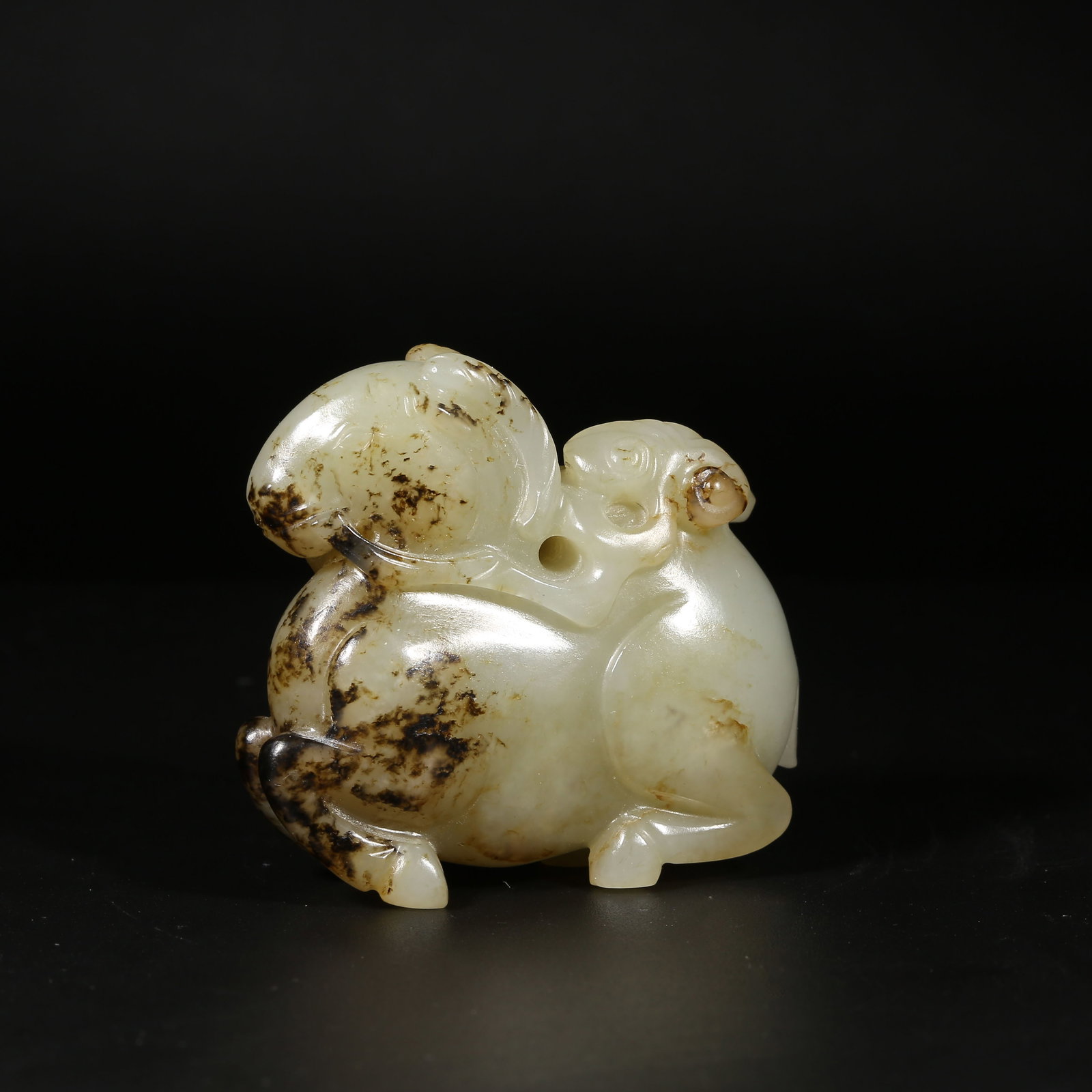 A HETIAN JADE RECLINING SHEEP HOLDING A BRANCH (1 of 8)