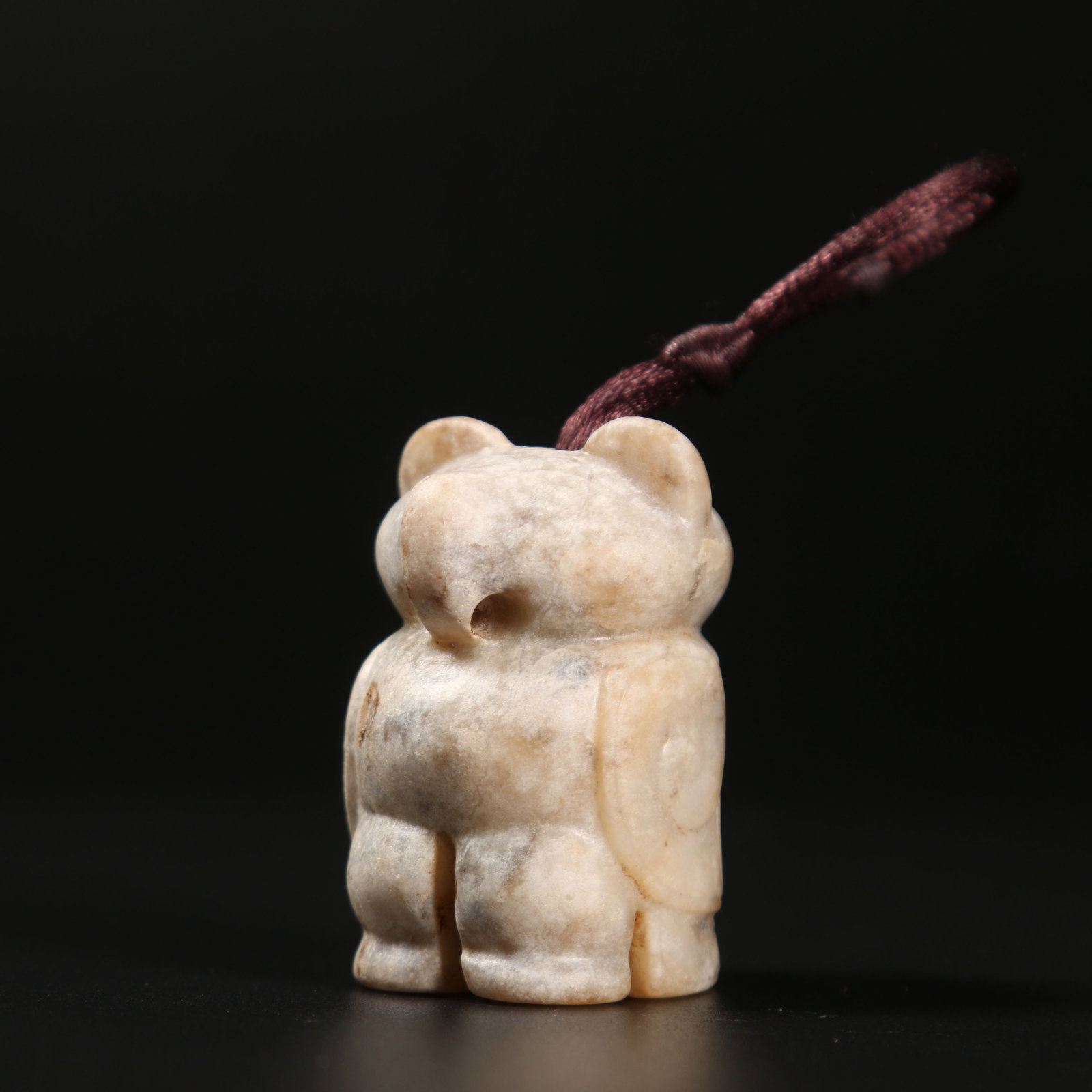 A ARCHAIC JADE AUSPICIOUS BEAST PENDANT (1 of 8)