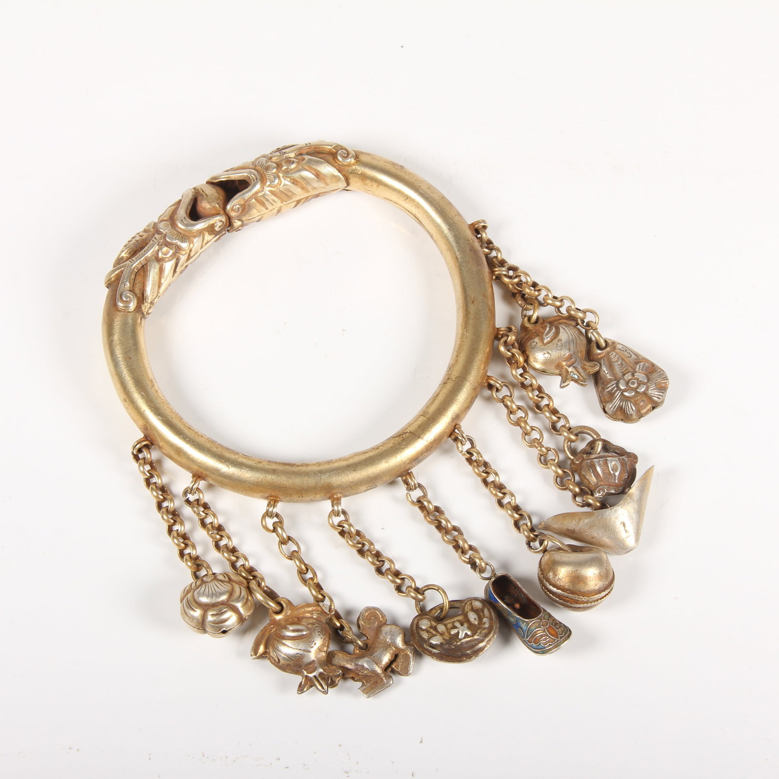 A GILT-SILVER BRACELET WITH DOUBLE DRAGON CHASING PEARL MOTIF (1 of 14)