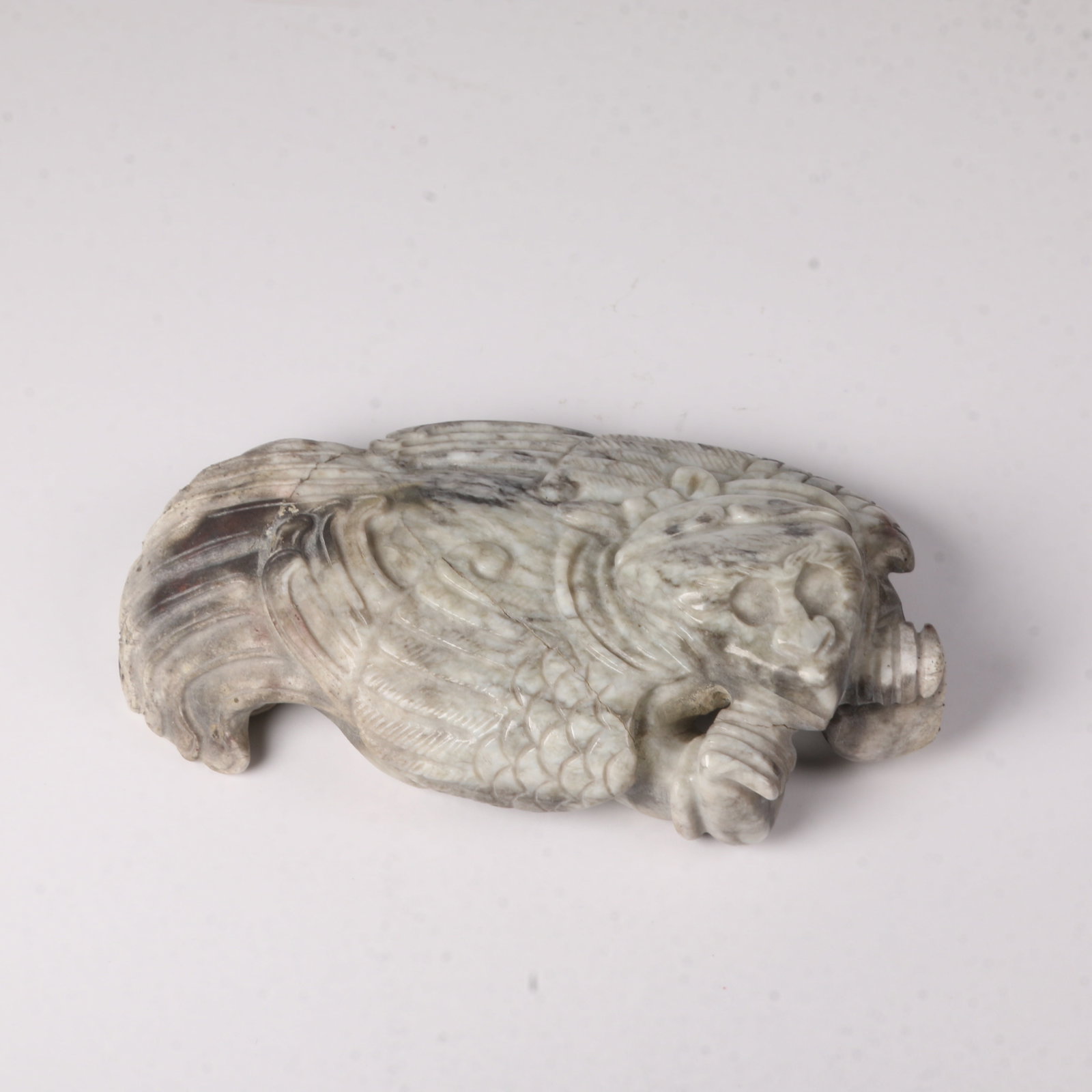 A HETIAN JADE WINGED FIGURE ORNAMENT (1 of 9)